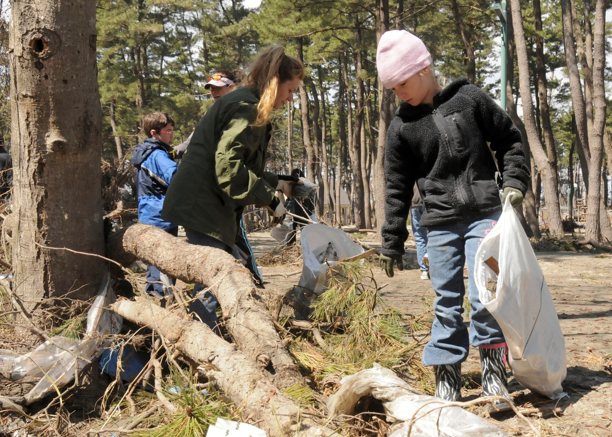 Anyka Perzynski-Drilling, 8, and her mom, Lindsey Drilling, search for debris at a park April 12, 2011, in Hachinohe, Japan.  (U.S. Air Force photo/Staff Sgt. Rachel Martinez) 
