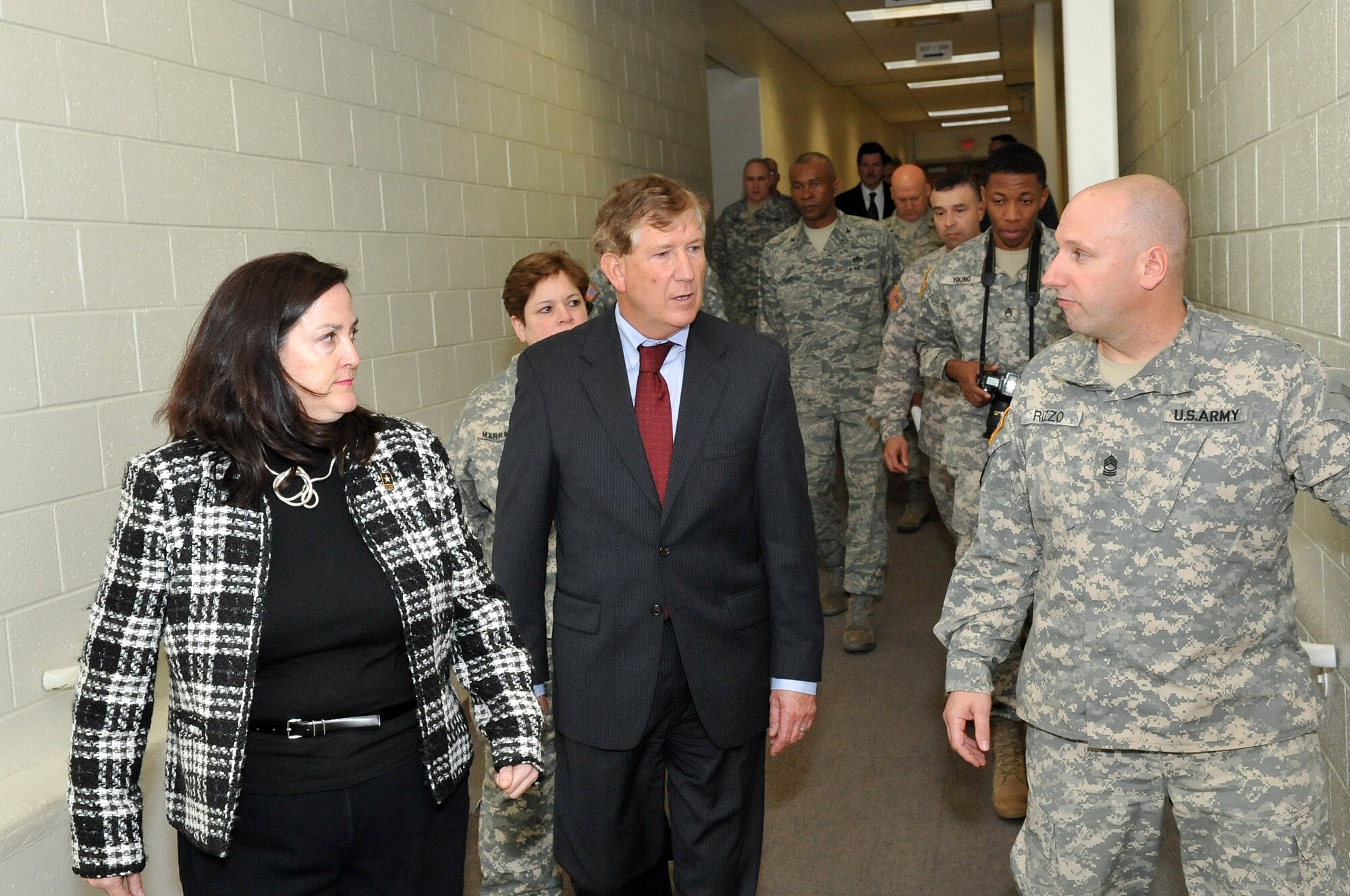 The Honorable Katherine Hammack, Assistant Secretary of the Army for Installations, Energy and Environment, and the Honorable Terry Yonkers, Assistant Secretary of the Air Force for Installations, Environment and Logistics, are given a brief tour of the New Jersey Army National Guard Battle Lab by Army Master Sgt. Mark Rizzo during their tour of Joint Base McGuire-Dix-Lakehurst April 7. (U.S. Air Force photo by Wayne Russell/Released)