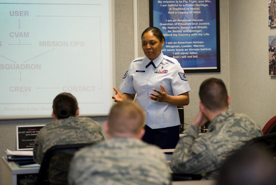 Technical Sgt. Kenya L. Martin, First Term Airmen Center non-commissioned officer In Charge, gives FTAC students a “warrior role” briefing to illustrate how their collective jobs support the special air missions on Joint Base Andrews April 13. (Photo by Bobby Jones) 