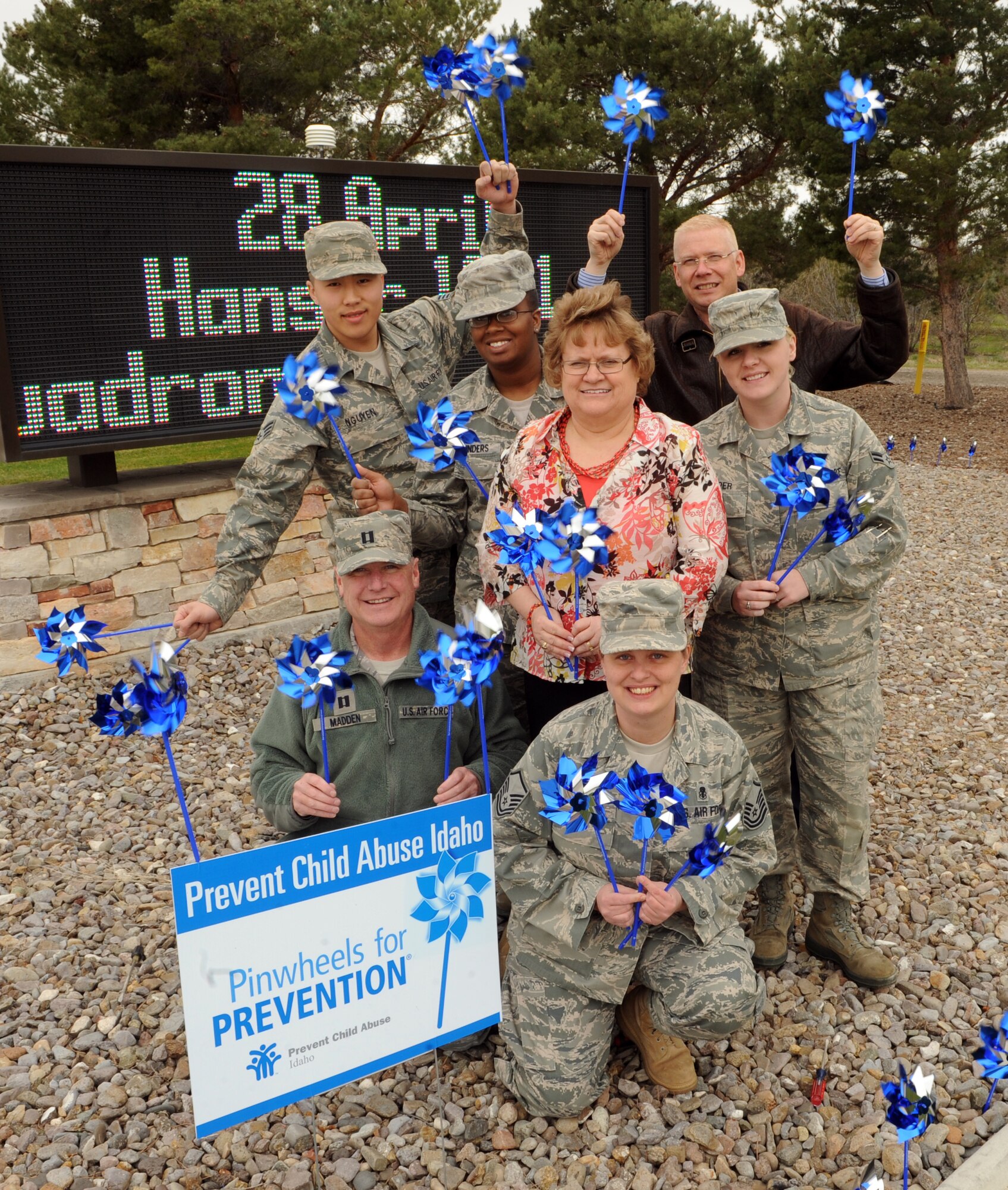 MOUNTAIN HOME AIR FORCE BASE, Idaho – Members of the 366th Medical Group pose for a picture after “planting” pinwheels around the main gate marquee to help raise awareness for the prevention of child abuse April 6. April is child abuse prevention month. In 2006, an estimated 905,000 children in the United States were found to be victims of child abuse and neglect. For more information on how to prevent child abuse visit: www.childwelfare.gov. (U.S. Air Force photo by Senior Airman Debbie Lockhart)