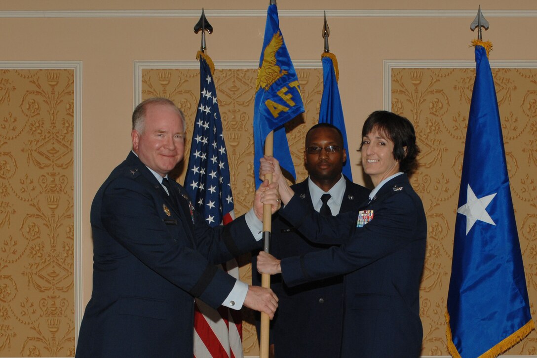 Brig. Gen. Larry K. Grundhauser, Headquarters Air Combat Command director of intelligence, transfers command of the Air Force Targeting Center to Col. Carol Northrup, commander, during a change of command ceremony at Langley Air Force Base, Va., April 13, 2011. The AFTC’s mission is to enable the integration of capabilities across air, space and cyberspace to deliver precise coercive effects in national defense and the global interests of the U.S. (U.S. Air Force photo/Airman 1st Class Teresa Zimmerman/Released)