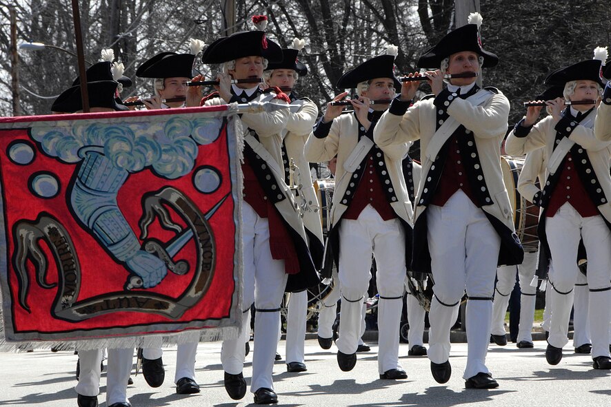 BEDFORD, Mass. – Fife and drum units march down Great Road as part of the Bedford Pole Capping celebration on April 9. Minuteman companies from across the region gathered in Bedford to watch a Patriot reenactor scale a pole and declare liberty. This is one of many events leading up to this year’s Patriots Day on April 18. (U.S. Air Force photo by Linda LaBonte Britt)