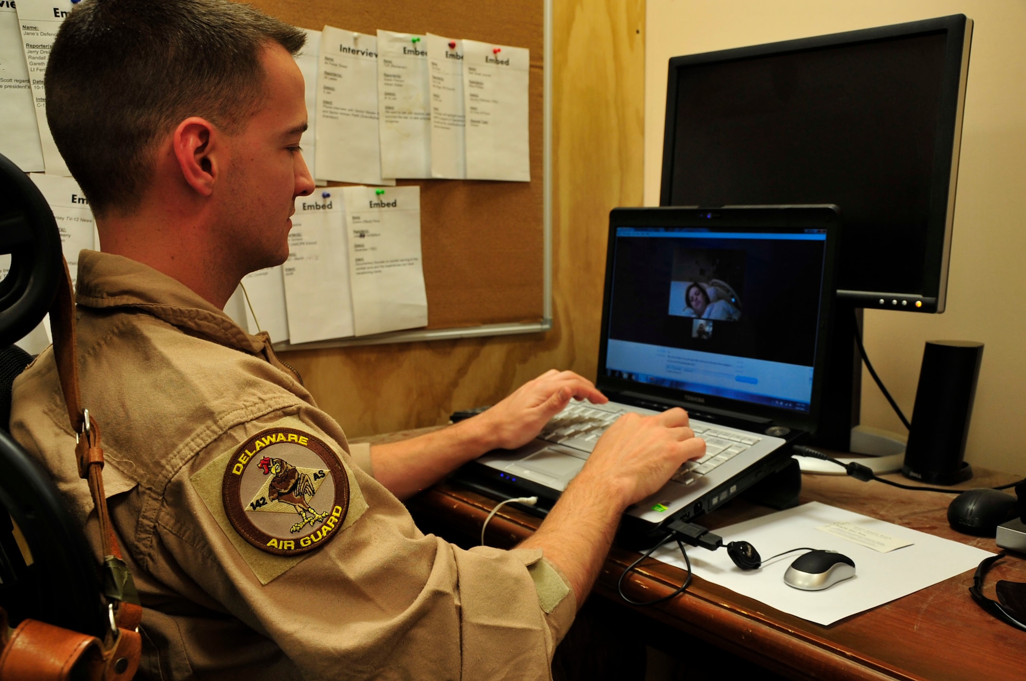 U.S. Air Force Tech. Sgt. Ryne Regan, 774th Expeditionary Airlift Squadron, watches patiently as his wife Toshia Regan give birth to the couple's first child via Skype, April 9. Sarah Grace Regan, 8 lbs. 3 ounces was born at 11:23 p.m.at a hospital in Lancaster, Penn., while her father witnessed thousands of miles away at Bagram Airfield, Afghanistan. (U.S. Air Force photo by Capt. Erick Saks)
