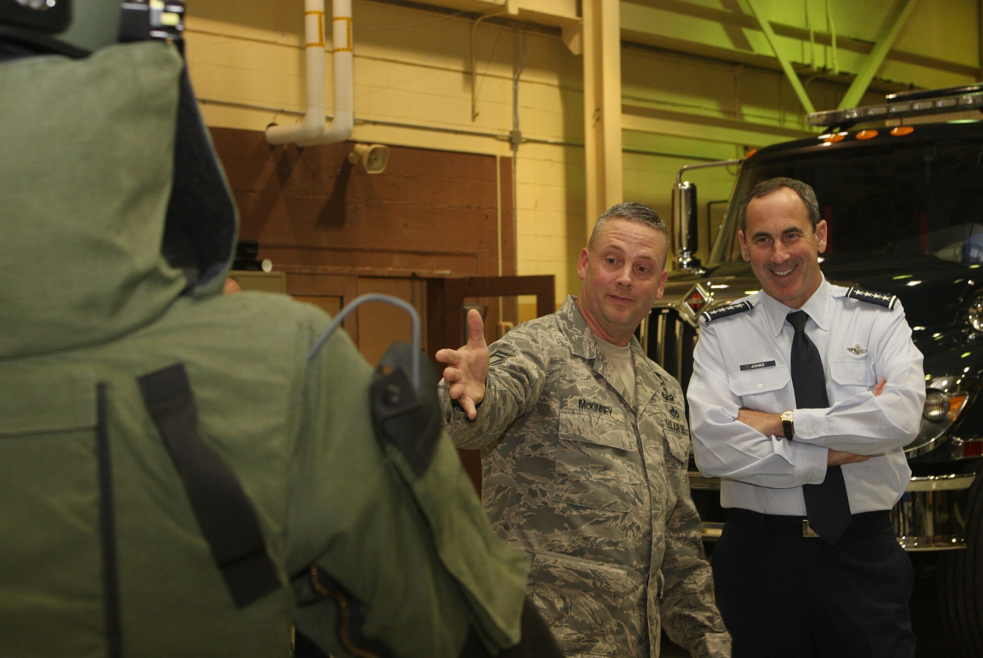 Senior Master Sgt. Bradley McKinney from the 94th Civil Engineer Squadron, Explosive Ordinance Disposal Flight, briefs Gen. Ray Johns, Commander of Air Mobility Command during his visit to Dobbins Air Reserve Base, Ga., and Apr 11. (U.S. Air Force Photo/Don Peek)