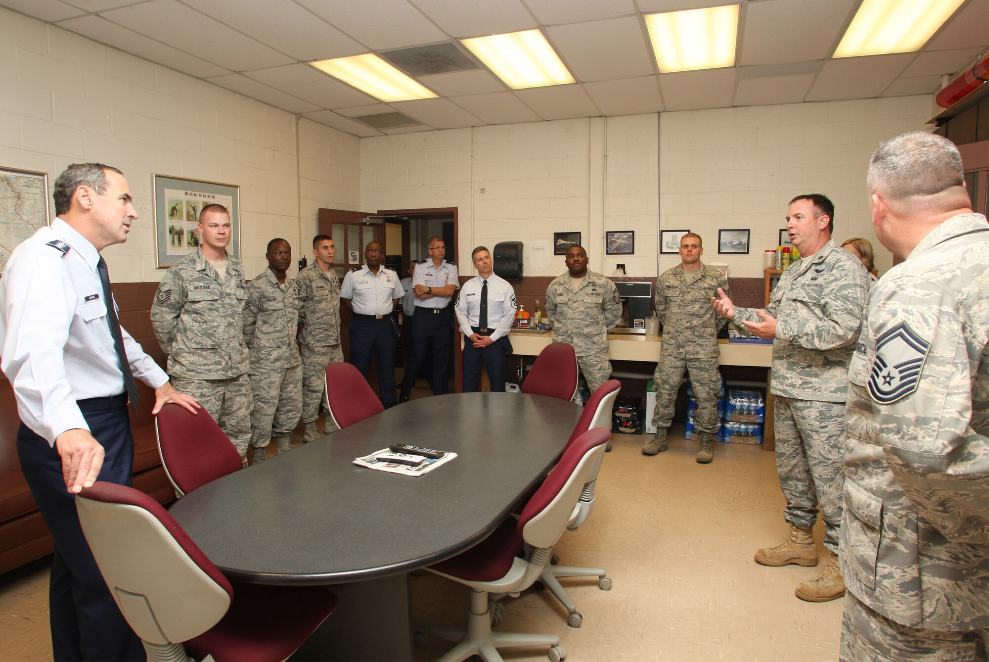 Gen. Ray Johns, Commander of the Air Mobility Command visits with members of the 94th Civil Engineer Squadron, Explosive Ordinance Disposal Flight as a part of his tour of Dobbins Air Reserve Base, Ga., and Apr 11. (U.S. Air Force Photo/Don Peek)