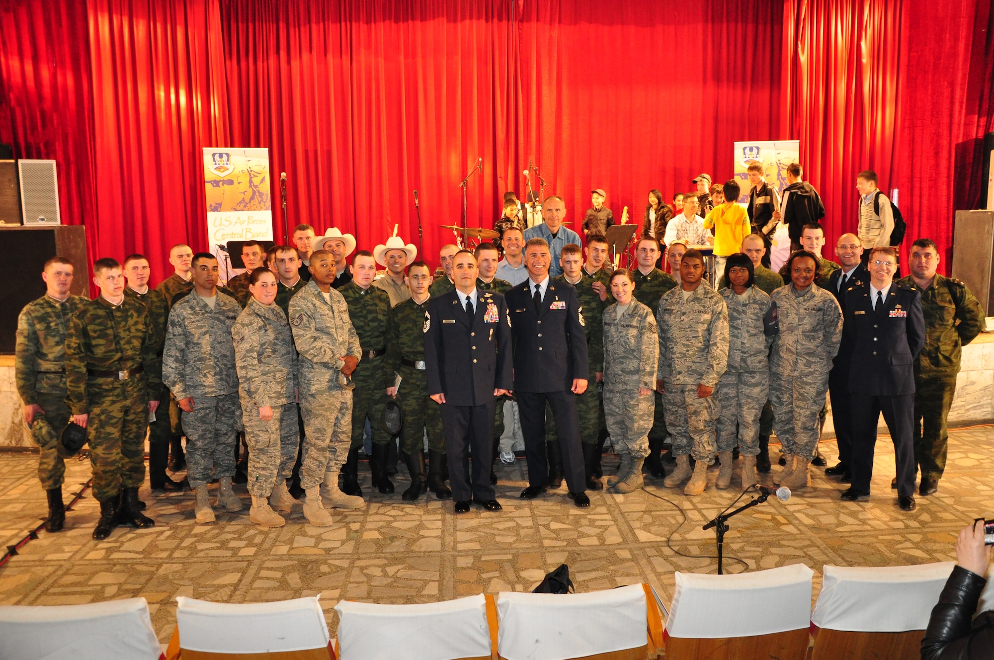 Members from U.S. & Russian military pause for a special moment after AFCENT Band Wild Blue Country's performance at the Kant House of Culture. (U.S. Air Force photo by Master Sgt. Daniel Nathaniel III)