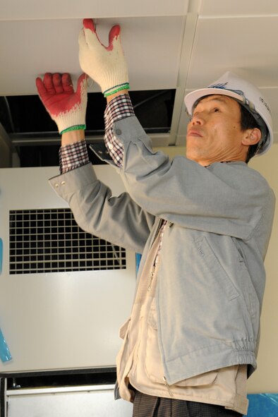 KUNSAN AIR BASE, Republic of Korea -- A Korean construction worker, contracted by the Army Corps of Engineers, installs insulation in a unit at Benjo Heights here April 14. Construction projects like the one seen here are important as quality of life for Airmen is of utmost importance to the Air Force. (U.S. Air Force photo/Tech. Sgt. Jonathan Pomeroy)