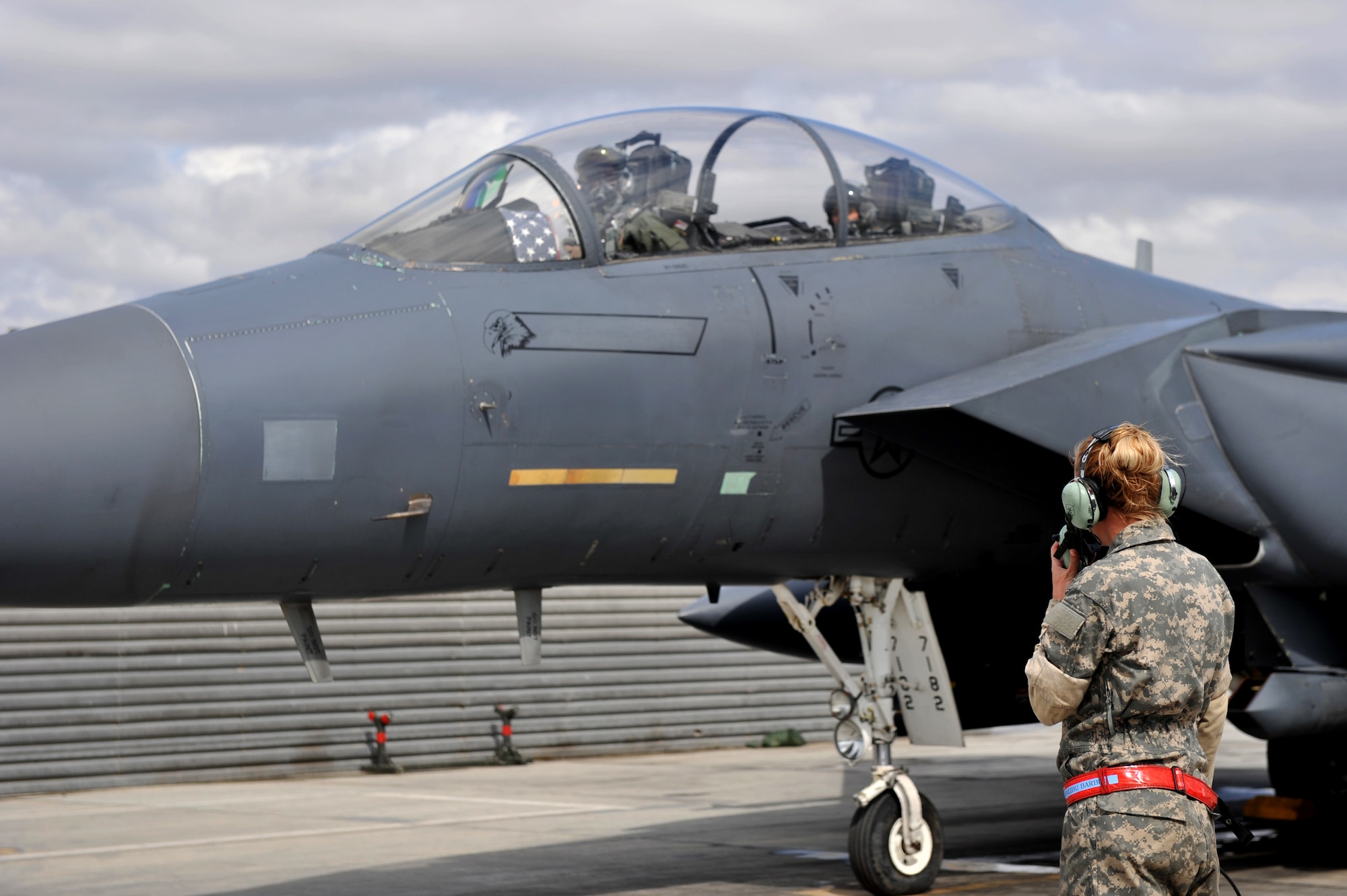 Staff Sgt. Tamara Rhone, 455th Expeditionary Aircraft Maintenance Squadron crew chief, conducts preflight checks before take off at Bagram Airfield, Afghanistan, March 29, 2011. Sergeant Rhone is deployed from Mountain Home Air Force Base, Idaho. (U.S. Air Force photo by Senior Airman Sheila deVera)
