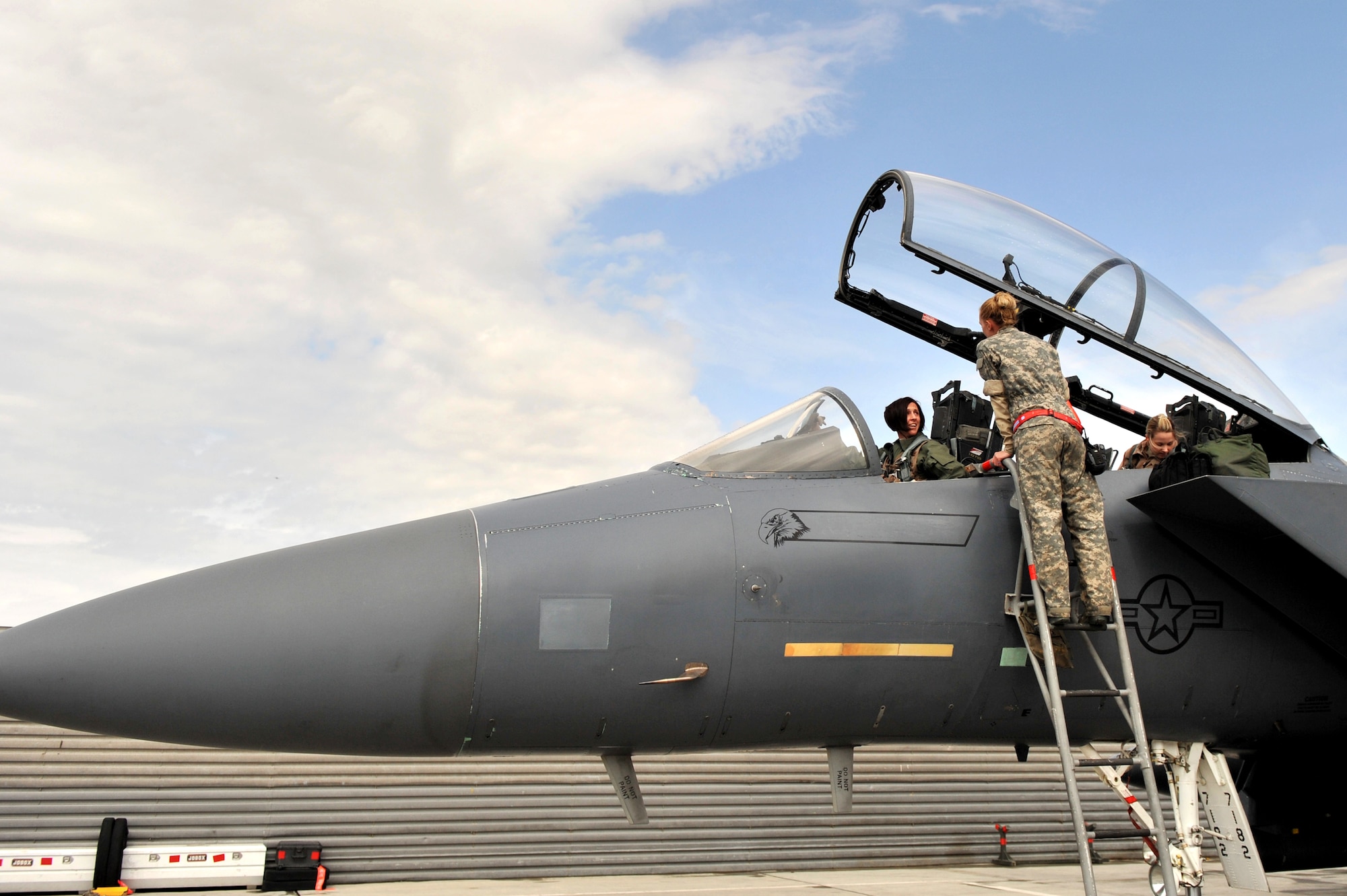 Staff Sgt. Tamara Rhone, 455th Expeditionary Aircraft Maintenance Squadron crew chief, talks to Maj. Christine Mau, 455th Air Expeditionary Wing executive officer and an F-15E Strike Eagle pilot, prior to the aircraft's launch at Bagram Airfield, Afghanistan, March 29, 2011. (U.S. Air Force
photo by Senior Airman Sheila deVera)
