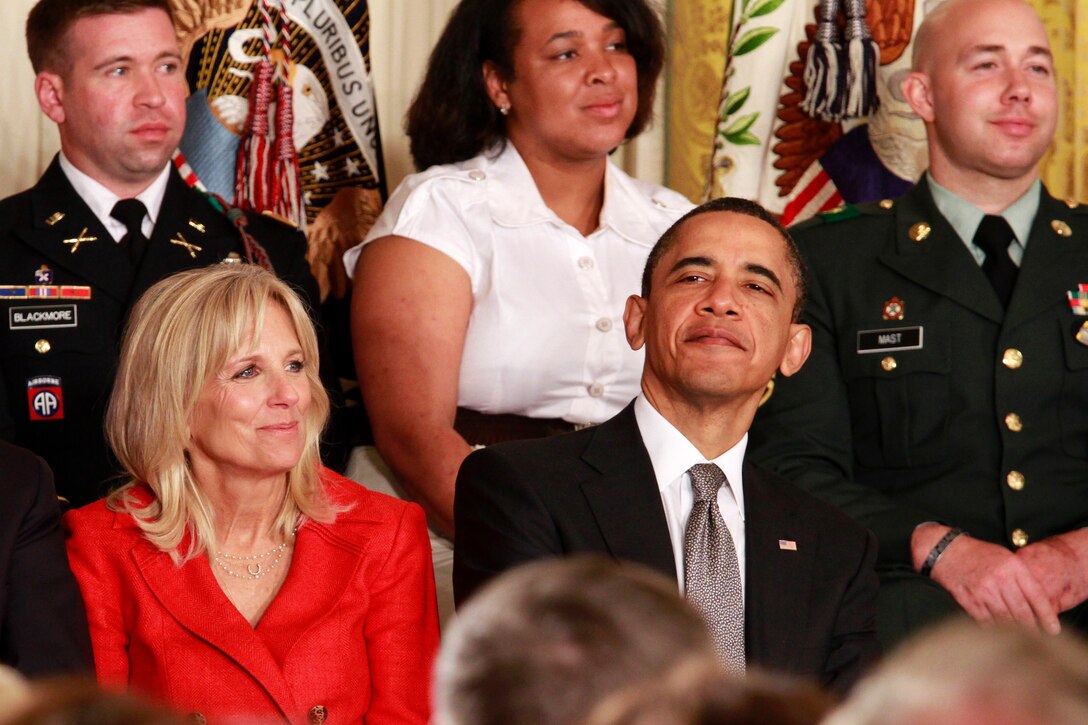 President Barack Obama and Dr. Jill Biden listen as First Lady Michelle Obama explains the importance of "Joining Forces," a national initiative encouraging all Americans to support service members and their families, April 12, 2011. 