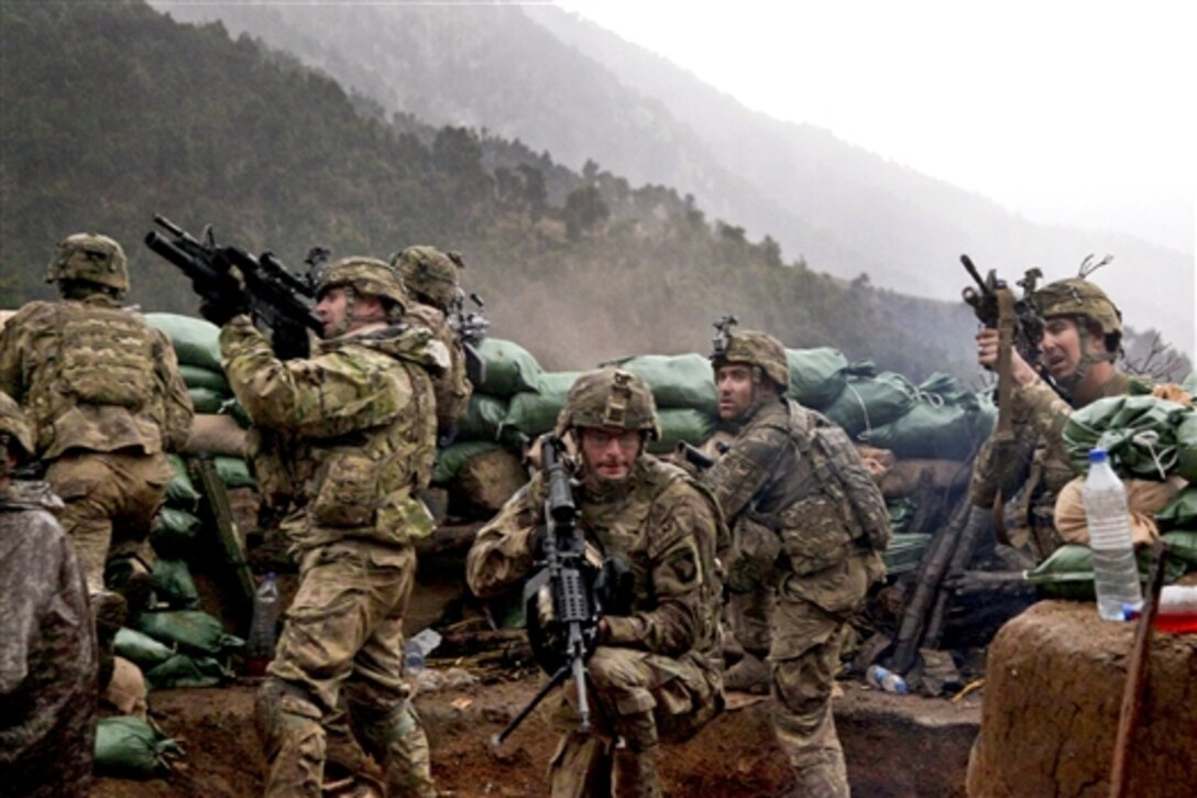 U.S. Army soldiers return fire during a firefight with Taliban forces in Barawala Kalay Valley in Kunar province, Afghanistan, March 31, 2011. The soldiers are assigned to the 101st Airborne Division's 2nd Battalion, 327th Infantry Regiment.