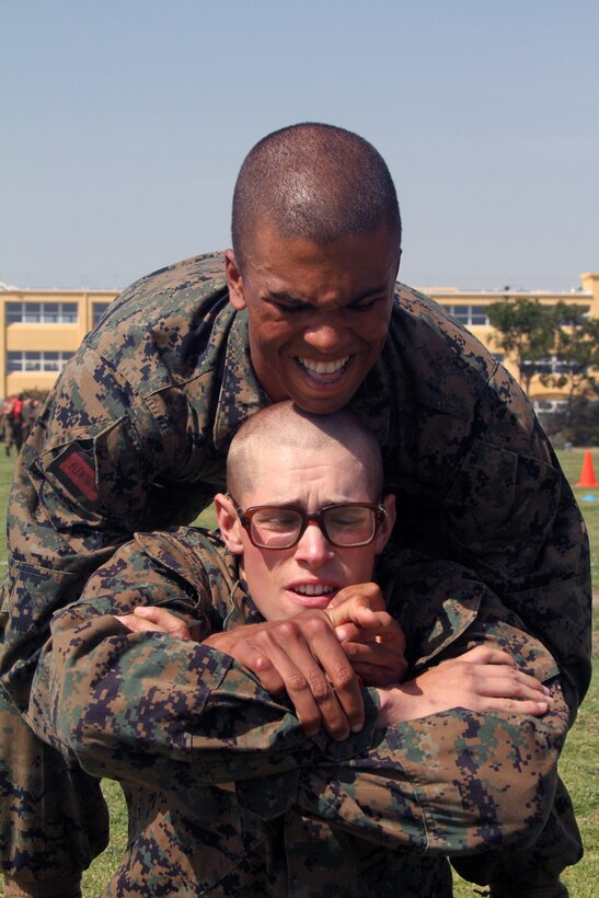 Recruit Jonathon Glenn lifts Recruit Alexander Edwards, both of Company C, 1st Recruit Training Battalion, during the Combat Fitness Test. The CFT is an annual training requirement for all Marines to ensure they’re able to endure the rigors of combat.