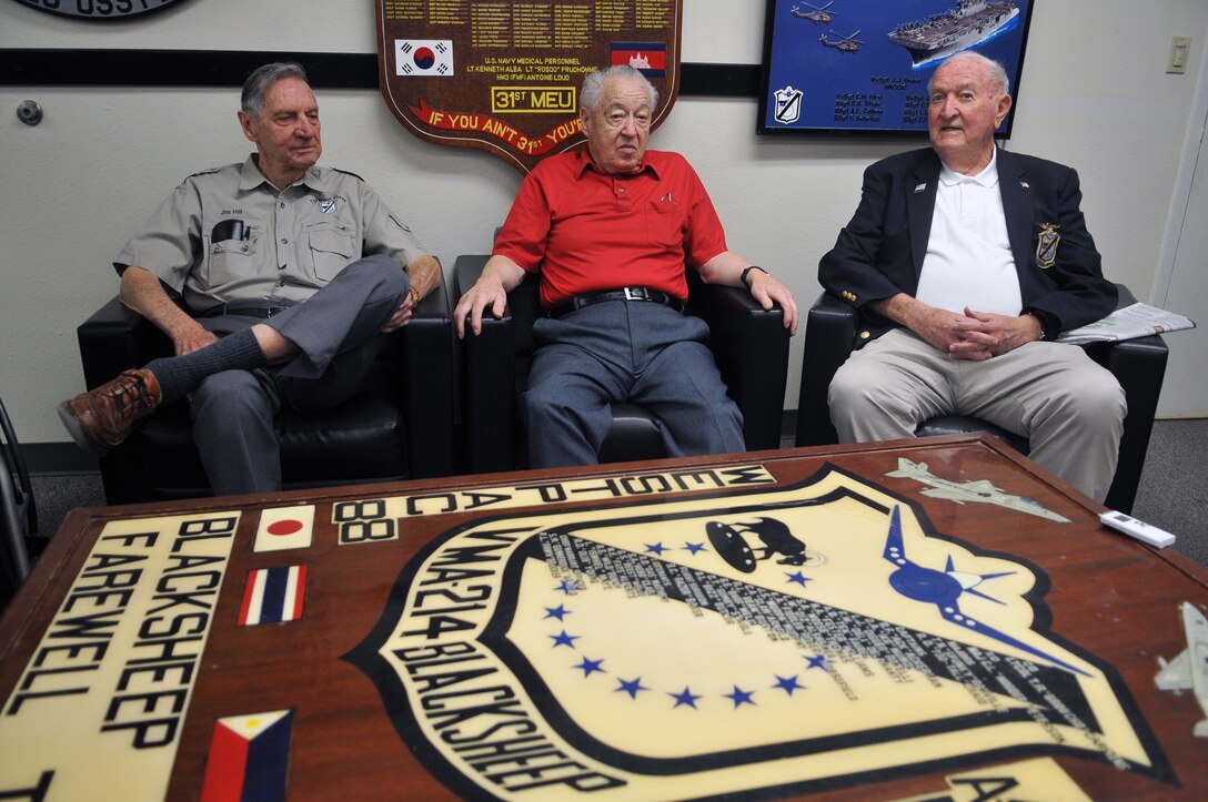 Jim Hill, Ed Harper and Harry Johnson, all original Marine Attack Squadron 214 pilots and three of the only five still remaining, catch up with each other before speaking with media in the squadron’s ready room April 14, 2011. All served under Medal of Honor recipient and first Black Sheep commanding officer Gregory “Pappy” Boyington during the squadron’s first combat deployment in the Pacific in 1943.