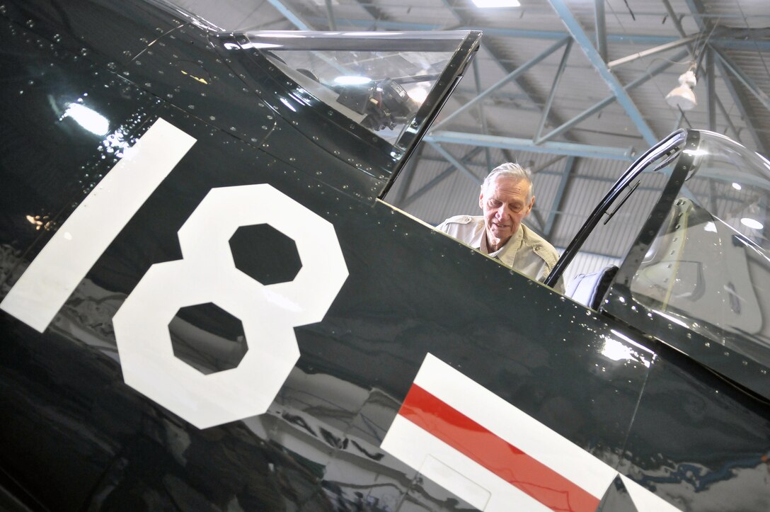 Jim Hill, original Marine Attack Squadron 214 pilot, examines the cockpit of an F4U-Corsair at the squadron’s hangar April 14, 2011, just as he did when he flew the aircraft almost 70 years ago in World War II. The Black Sheep hosted three out of five of their remaining founders for a reunion day and dinner, bringing them together for the first time since 1994. All served under Medal of Honor winner and first Black Sheep commanding officer Gregory “Pappy” Boyington during the squadron’s first combat deployment in the Pacific in 1943.