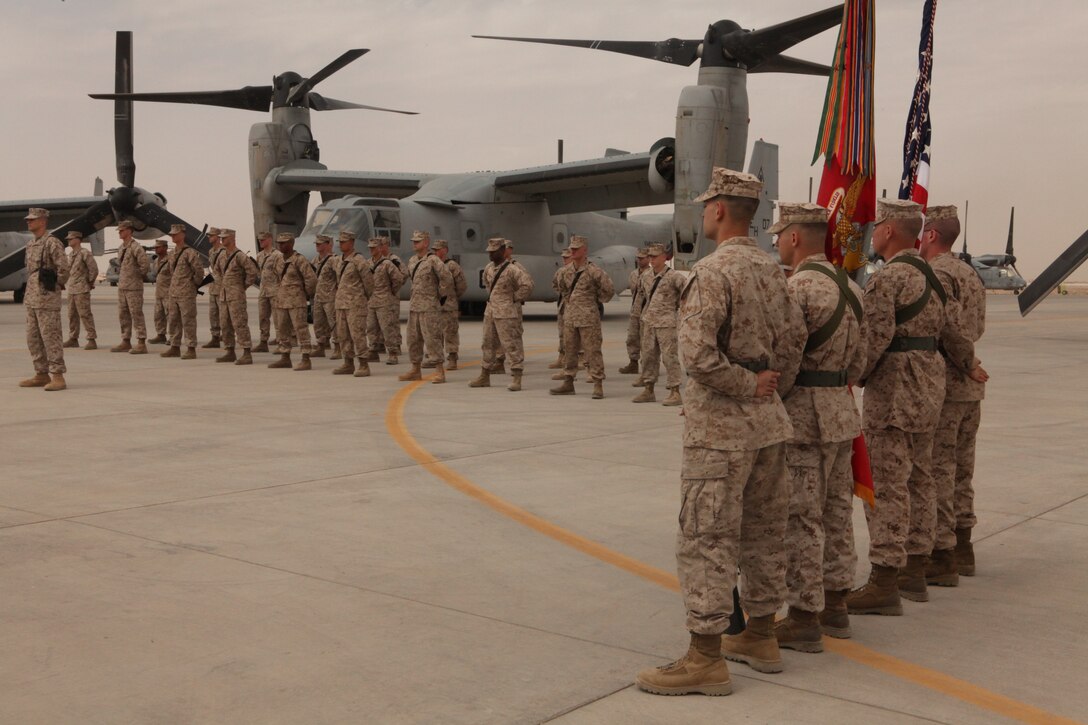 The Marines and sailors of Marine Medium Tiltrotor Squadron 264 stand in formation during a change of command ceremony at the squadron's hangar on Camp Bastion, Afghanistan, April 15. Lt. Col. Jeffrey P. Hogan relinquished command of the squadron to Lt. Col. Brian G. McAvoy. "It is hard to leave Marines I've worked with," said Hogan. "Especially while on deployment out here."