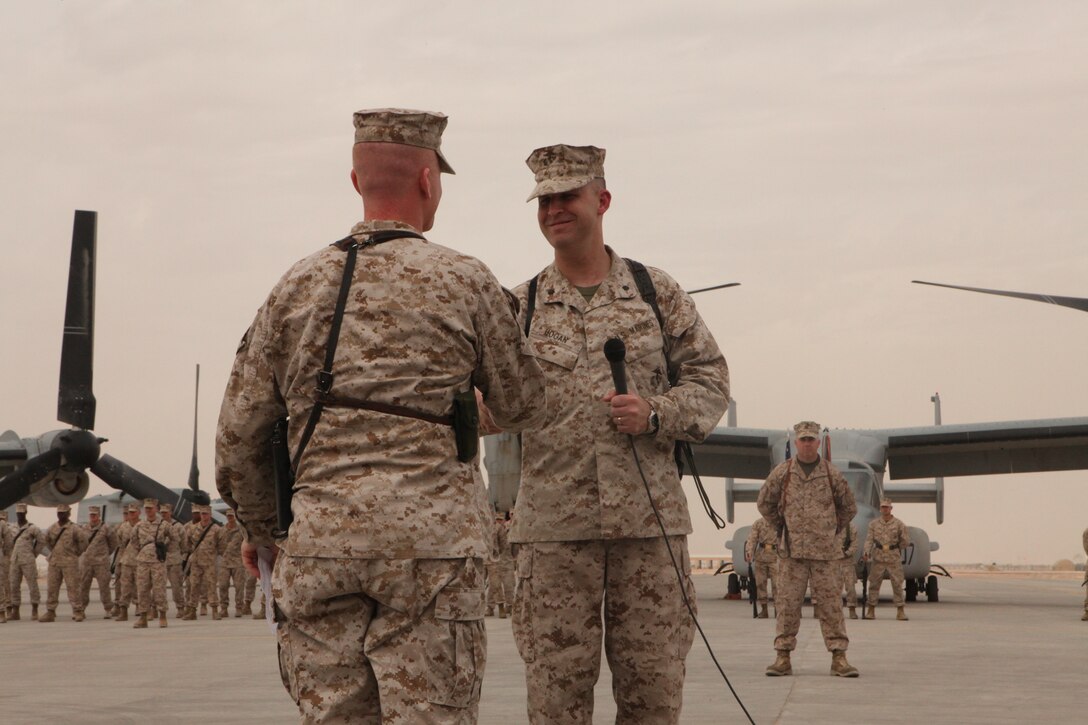 Lt. Col. Jeffrey P. Hogan relinquished command of the squadron to Lt. Col. Brian G. McAvoy in a ceremony at Camp Bastion, Afghanistan, April 15. . "It is hard to leave Marines I've worked with," said Hogan. "Especially while on deployment out here."