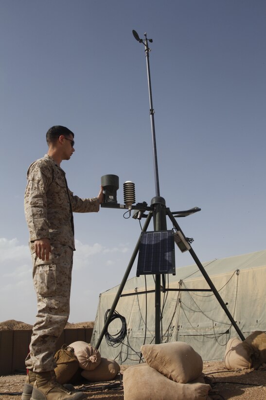 Sgt. Zachary M. Salter checks the automated weather observation system at the Marine Air Control Squadron 2 compound at Camp Dwyer, Afghanistan, April 15. The system takes weather readings every five minutes and provides meteorological and oceanographic analyst Marines with valuable atmospheric information. Salter is a METOC analyst with the MACS-2detachment deployed out of Marine Corps Air Station New River, N.C.