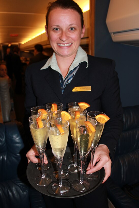 Scott Air Force Base, Il--Staff Sgt. Andrea Korobey, was one of several Air Force Reserve flight attendants, who served snacks and sparkling apple cider to some 70 local civic leaders during a tour of the 932nd Airlift Wing.  The group toured the C-9C and C-40 aircraft, operation facilities and heard a mission briefing.  The 932nd AW mission is to provide safe, world-class transport to our nation's civilian and military leadership.  (U.S. Air Force photo/Tech. Sgt. Gerald Sonnenberg) 