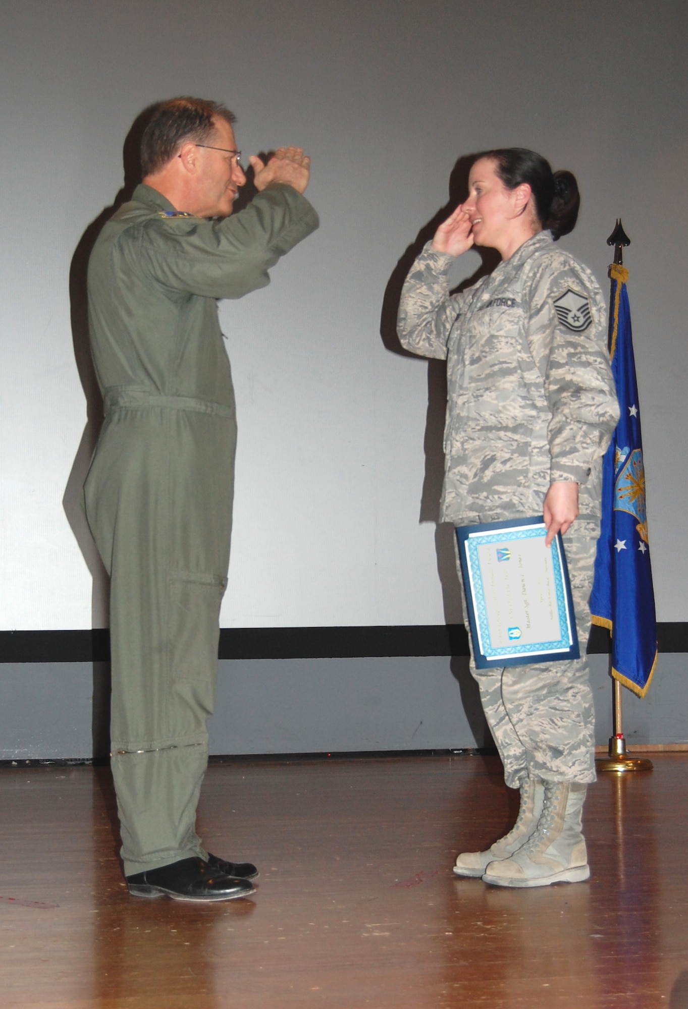 NELLIS AIR FORCE BASE, Nev. -- (Right) Master Sgt. Dawn Jones, 926th Aerospace Medicine Squadron medical technician, is recognized as the 926th Group's 2010 Senior Noncommissioned Officer of the Year by Col. Herman Brunke, 926th GP commander, during a commander's call here April 2. (U.S. Air Force photo/Capt. Jessica Martin)