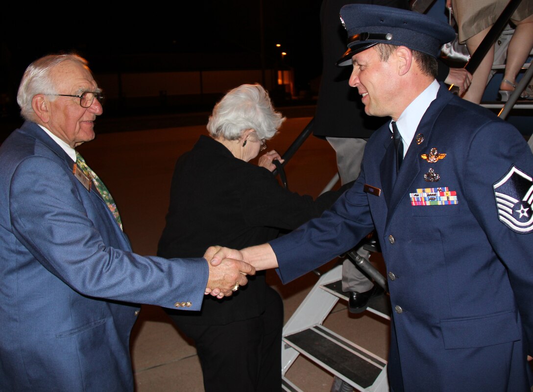 Master Sgt. Brian Fark , a dedicated crew chief, greets local civic leaders  before they step aboard and tour the C-9C aircraft.  The local group was served snacks by 932nd Airlift Wing flight attendants, toured facilites and heard a mission briefing.  The 932AW mission is to provide, safe, world-class airlift to our nation's civilian and military leadership. The Belle-Scott Committee is comprised of local community leaders who meet with Scott Air Force Base officials on a recurring basis.  (U.S. Air Force photo/Tech. Sgt. Dan Oliver)