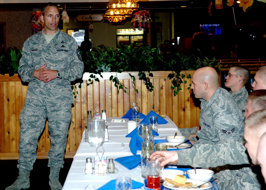 Chief Master Sgt. Martin Klukas, Air Combat Command command chief, shares a story with Airmen at the Bandit Inn dining facility at Ellsworth Air Force Base, S.D., April 14, 2011. The story was about his time in U.S. Army Ranger School that taught Airmen to always pursue their dreams and never lose sight of their goals. (U.S. Air Force photo by Senior Airman Jarad A. Denton)