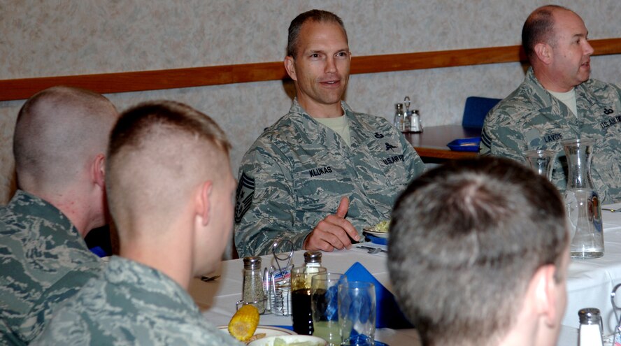 Chief Master Sgt. Martin Klukas, Air Combat Command command chief, and Chief Master Sgt. Brian Lavoie, 28th Bomb Wing command chief, answer questions from Airmen during a dinner at the Bandit Inn dining facility at Ellsworth Air Force Base, S.D., April 14, 2011. Airmen working swing and mid-shift working Airmen were able to voice questions and concerns at an open forum with Chief Klukas. (U.S. Air Force photo by Senior Airman Jarad A. Denton)