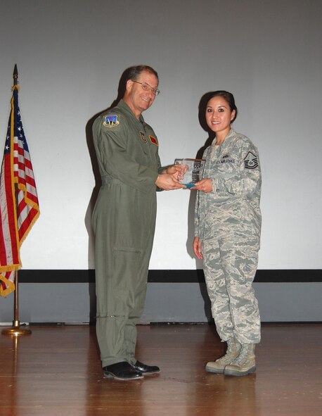 NELLIS AIR FORCE BASE, Nev. -- (Right) Master Sgt. MaryAnn Martin, 706th Fighter Squadron superintendent, is recognized as the 926th Group's 2010 Senior Noncommissioned Officer of the Half by Col. Herman Brunke, 926th GP commander, during a commander's call here April 2. (U.S. Air Force photo/Capt. Jessica Martin)