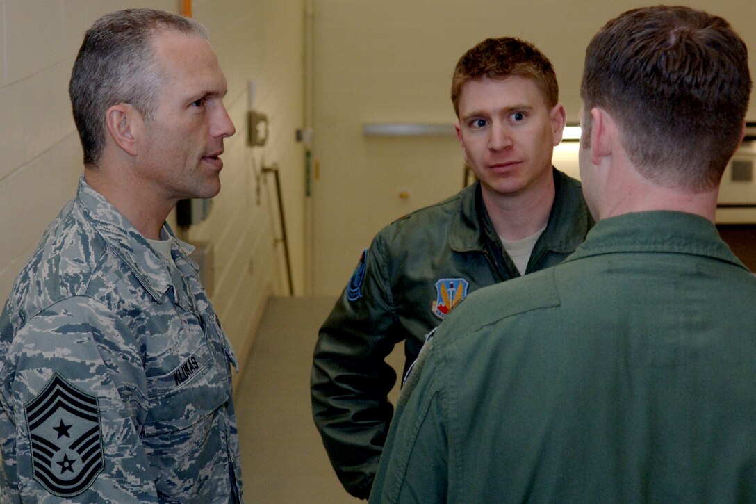 Chief Master Sgt. Martin Klukas, Air Combat Command command chief, speaks with Maj. Jan-Peter Linch, 28th Bomb Wing wing weapons officer, before entering the B-1B Lancer simulator, at Ellsworth Air Force Base, S.D., April 14, 2011. Chief Klukas was able to watch as B-1 aircrew members from Ellsworth trained with joint terminal attack controllers from Iowa through a real-time communication link. (U.S. Air Force photo by Senior Airman Jarad A. Denton)