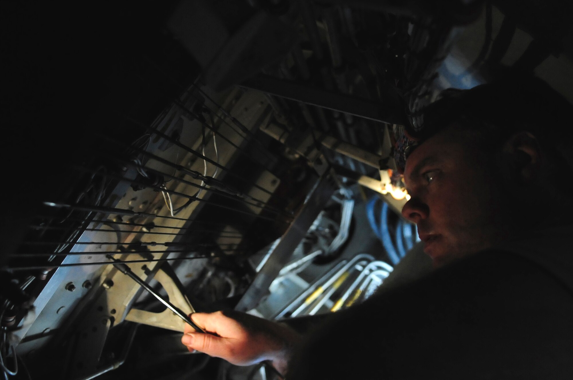 110414-F-UA979-002 -- WESTERN EUROPE (April 14, 2011) ? Tech. Sgt. Brett McVay, fuels cell technician, investigates a potential fuel leak in the aft boost pump in the wing of a KC-10 Extender. Sergeant McVay is deployed here with the 313th Air Expeditionary Wing from the 349th Air Mobility Wing, Travis Air Force Base, Calif., in support of Operation Unified Protector. Operation Unified Protector is a NATO-led mission in Libya, to protect civilians and civilian-populated areas under threat of attack. The 313th AEW provides aerial refueling to U.S. and coalition aircraft with KC-135 Stratotankers and KC-10s. (U.S. Air Force photo/Senior Airman Ethan Morgan)