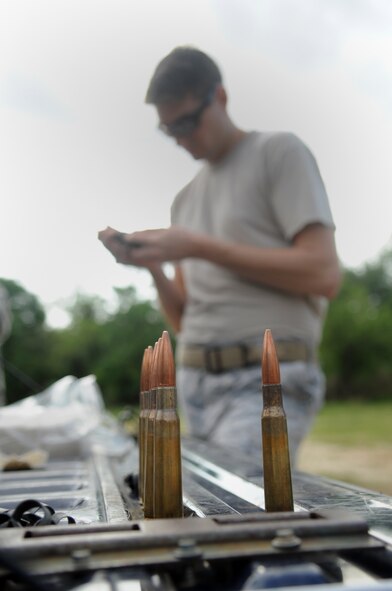 Senior Airman Jacob Baker, 23rd Civil Engineer Squadron explosive ordnance disposal journeyman, removes a ball tip from a .50 caliber round at Moody Air Force Base, Ga., April 15. Afterwards, the shell casing was used to propel a slug into an ordnance fuse and disable it. (U.S. Air Force photo/Airman 1st Class Douglas Ellis)(RELEASED)
