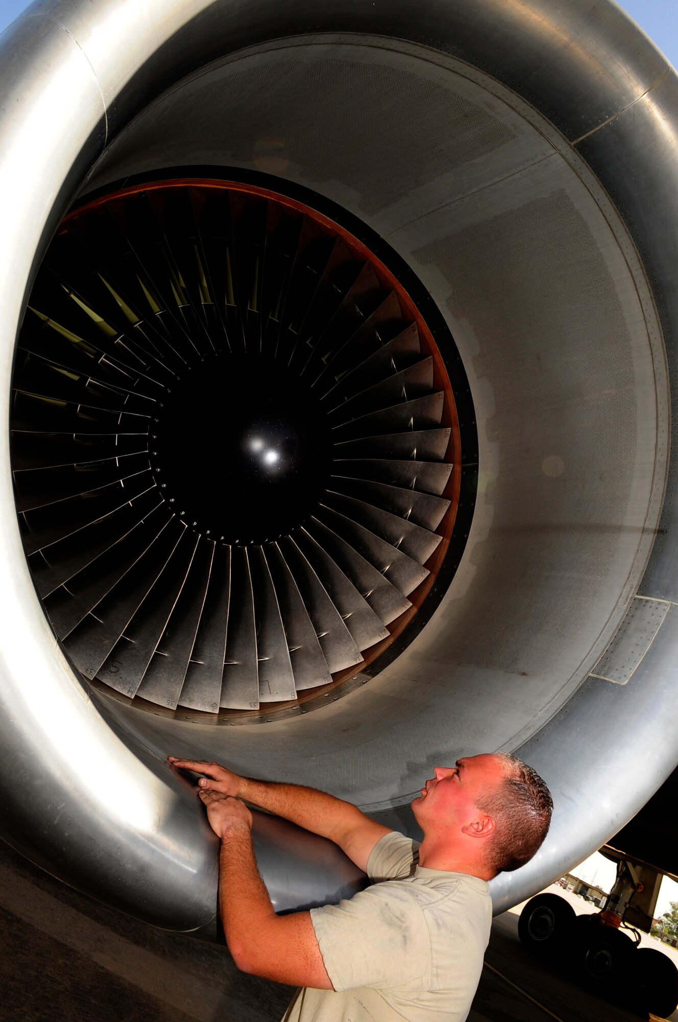 110414-F-UA979-001 -- WESTERN EUROPE (April 14, 2011) ? Senior Airman Richard Johnson, crew chief, checks the engine turbines of a KC-10 Extender. Airman Johnson is deployed here with the 313th Air Expeditionary Wing from the 349th Air Mobility Wing, Travis Air Force Base, Calif. in support of Operation Unified Protector. Operation Unified Protector is a NATO-led mission in Libya, to protect civilians and civilian-populated areas under threat of attack. The 313th AEW provides aerial refueling to U.S. and coalition aircraft with KC-135 Stratotankers and KC-10s. (U.S. Air Force photo/Senior Airman Ethan Morgan)