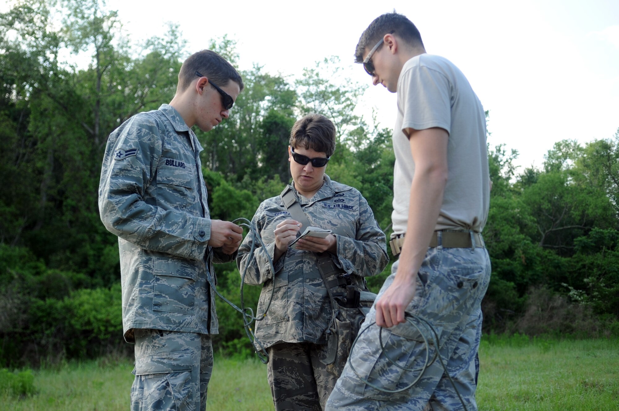 23rd Civil Engineer Squadron explosive ordnance disposal members calculate the length of M-700 time fuse needed for a desired fuse-burning time at Moody Air Force Base, Ga., April 15. This helped the EOD members have a better estimate of how much time they have before the .50 caliber round detonates. (U.S. Air Force photo/Airman 1st Class Douglas Ellis)(RELEASED)
