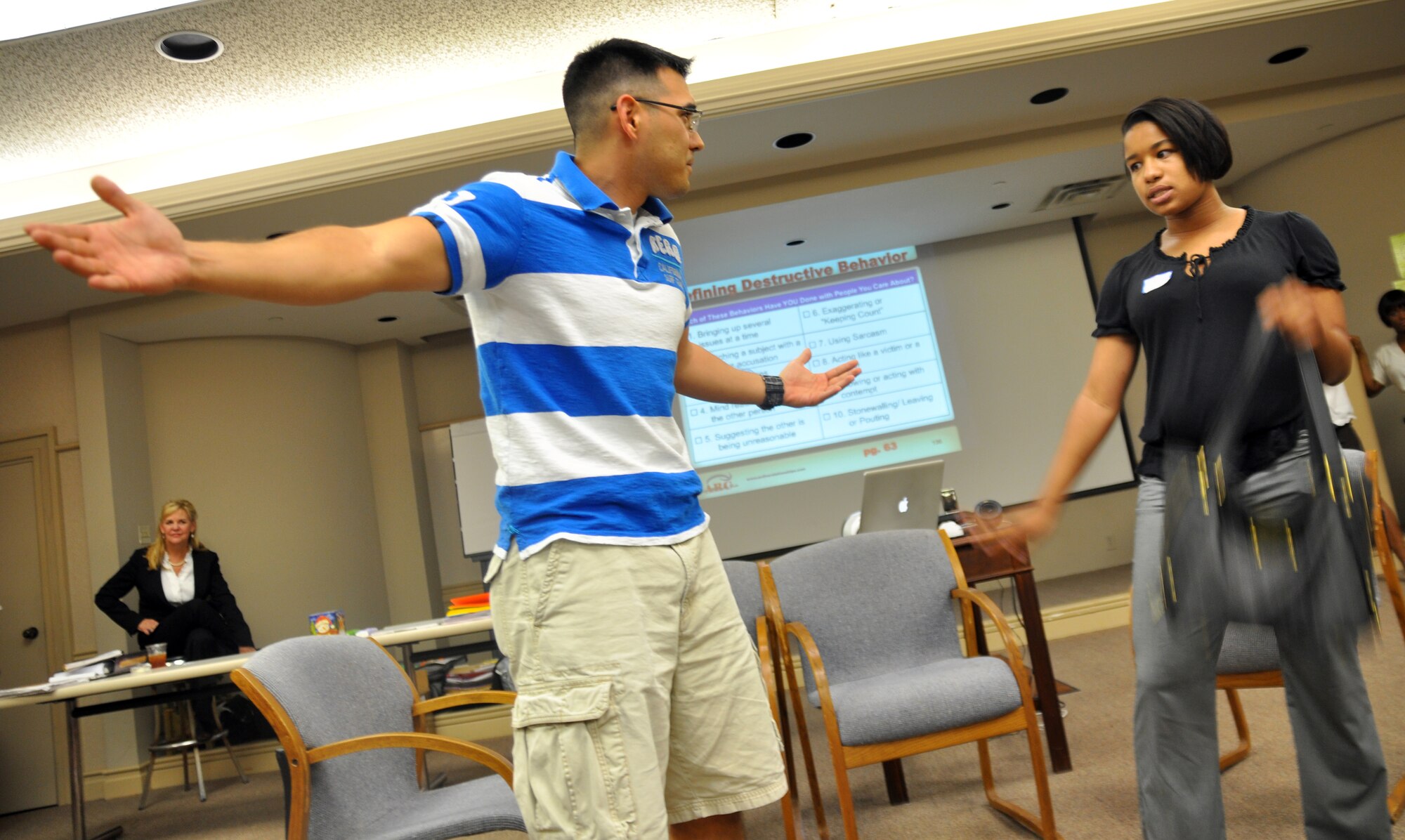 Chaplain (Maj.) Jason Raines and Tiara Skinner act out the “irrationality” negative behavior during a group exercise at the reintegration and marriage retreat held by the AFRC April 10 in Tuscaloosa, Ala. Mrs. Skinner is the wife of Senior Airman Marquis Skinner, 14th CS. (U.S. Air Force photo/Staff Sgt. Jacob Corbin)