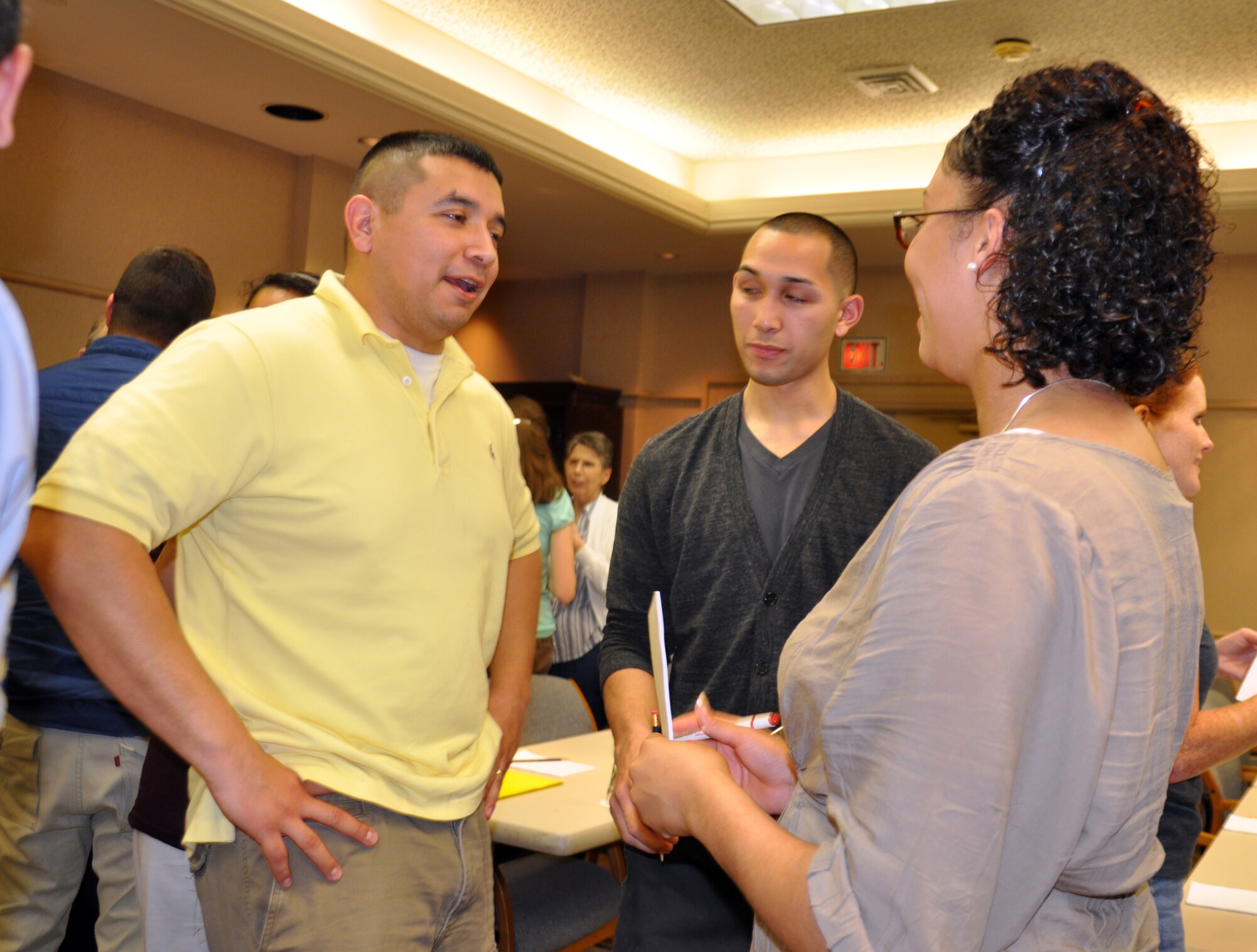 Tech. Sgt. John Solis speaks with Senior Airman Willie Lopez and Senior Airman JaQuari Lopez at the welcome session of the reintegration and marriage retreat held by the Airman and Family Readiness Center, on April 8. Sergeant Solis is a member of the 14th Security Forces Squadron and both senior airman are part of the 14th Communications Squadron. (U.S. Air Force photo/Staff Sgt. Jacob Corbin)