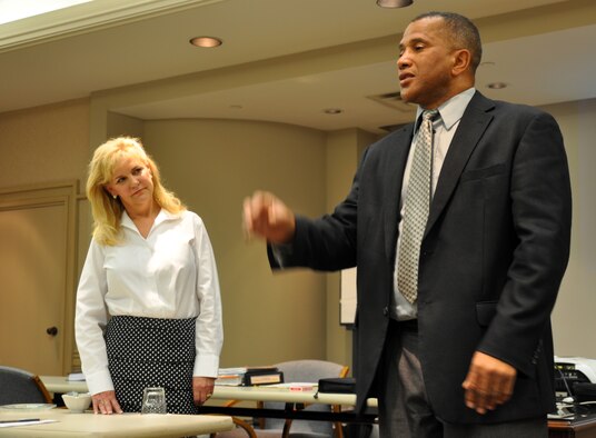 Anthony Landry and Kelly Simpson introduce themselves at the first workshop of the reintegration and marriage retreat held by the Airman and Family Readiness Center April 8-11. In addition to their training, both instructors were familiar with military life. Mr. Landry is a retired Army lieutenant colonel and Mrs. Simpson is the wife of a retired Air Force JAG. (U.S. Air Force photo/Staff Sgt. Jacob Corbin)