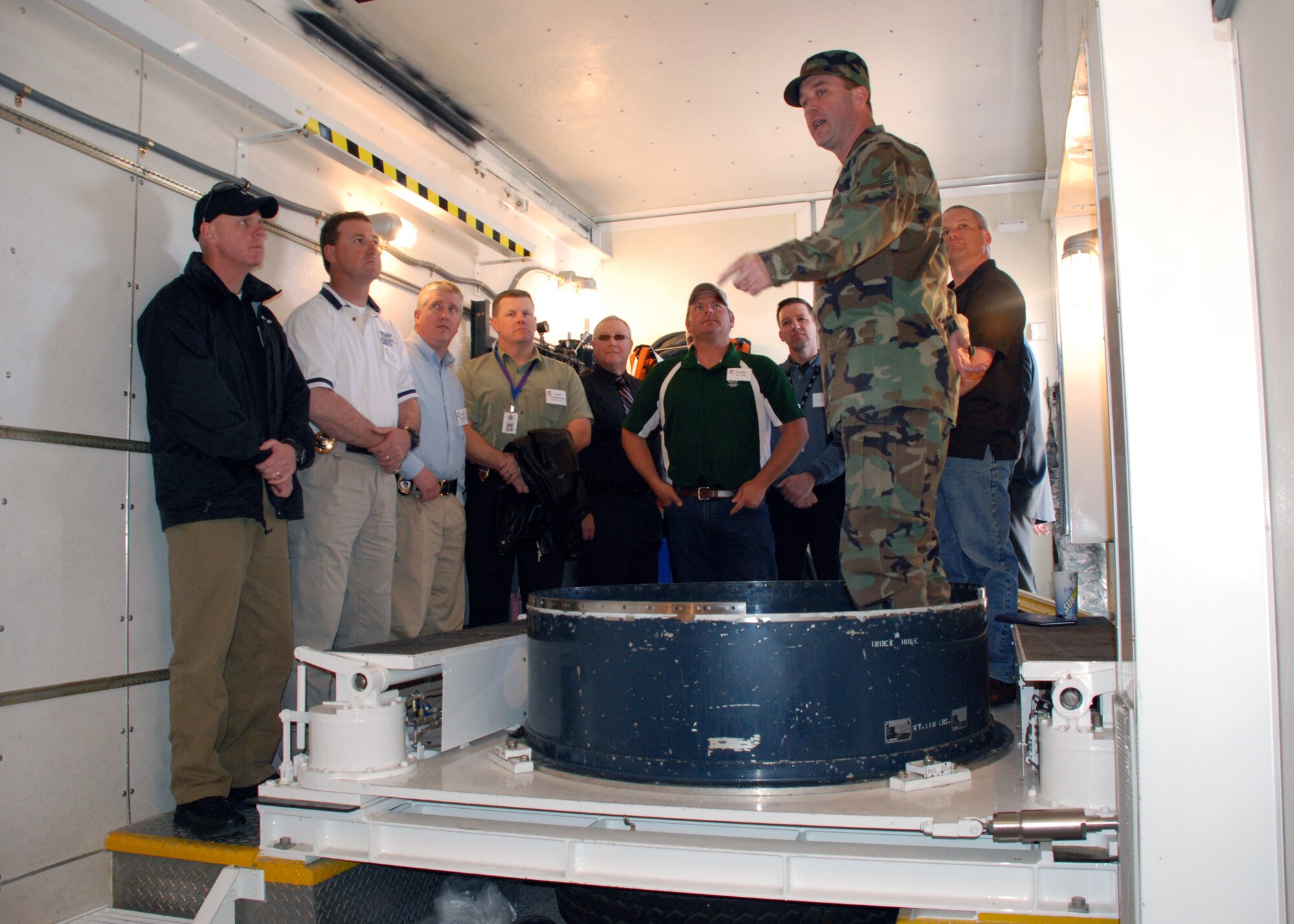 Master Sgt. Brian Peter, 90th Maintenance Group, explains missile maintenance, of a launch tube to the Second Annual Mayor’s ICBM Orientation Tour, April 12. The tour serves as an introduction to F. E. Warren to civic leaders and consisted of visits to the 90th Operations Group missile procedures trainer, Uniform-01 missile maintenance trainer, Fall Hall Community Center and the Trail’s End Club.  (U.S. Air Force photo by Staff Sgt. Torri Ingalsbe)
