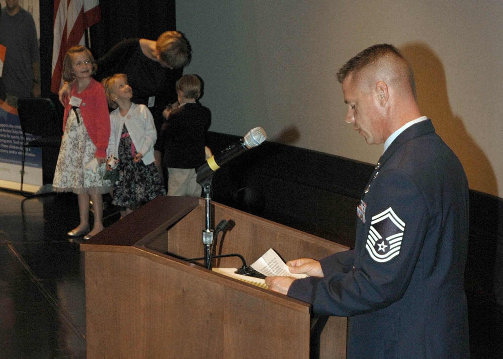 Senior Master Sgt. William Liston addresses the audience on behalf of his family at the Our Military Kids of the Year awards ceremony April 14, 2011, at the Navy Memorial in Washington. Sergeant Liston and his family were honored as the Our Military Kids Family of the Year. Our Military Kids is a nonprofit organization that provides artistic, athletic and educational grants to children of deployed National Guardsmen and military reservists. (U.S. Navy photo/Petty officer 2nd Class Patrick Gordon)