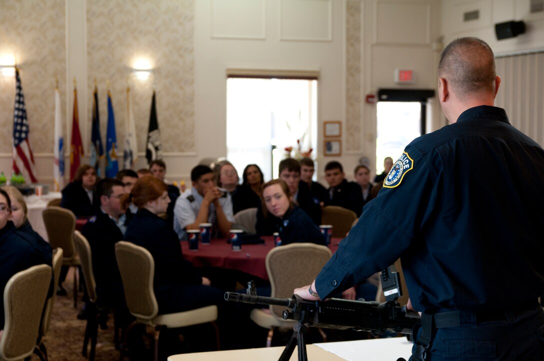 YOUNGSTOWN AIR RESERVE STATION, Ohio — Master Sgt. Robert Plant, a Security Forces Squadron member with the 910th Airlift Wing here, briefs a group of Air Force Junior Reserve Officer Training Corps (AFJROTC) members on various Air Force Reserve weapon systems. Approximately 75 junior ROTC members from Midview High School's AFJROTC Program attended a base tour and orientation flight Wednesday. U.S. Air Force photo by Mr. Eric M. White.
