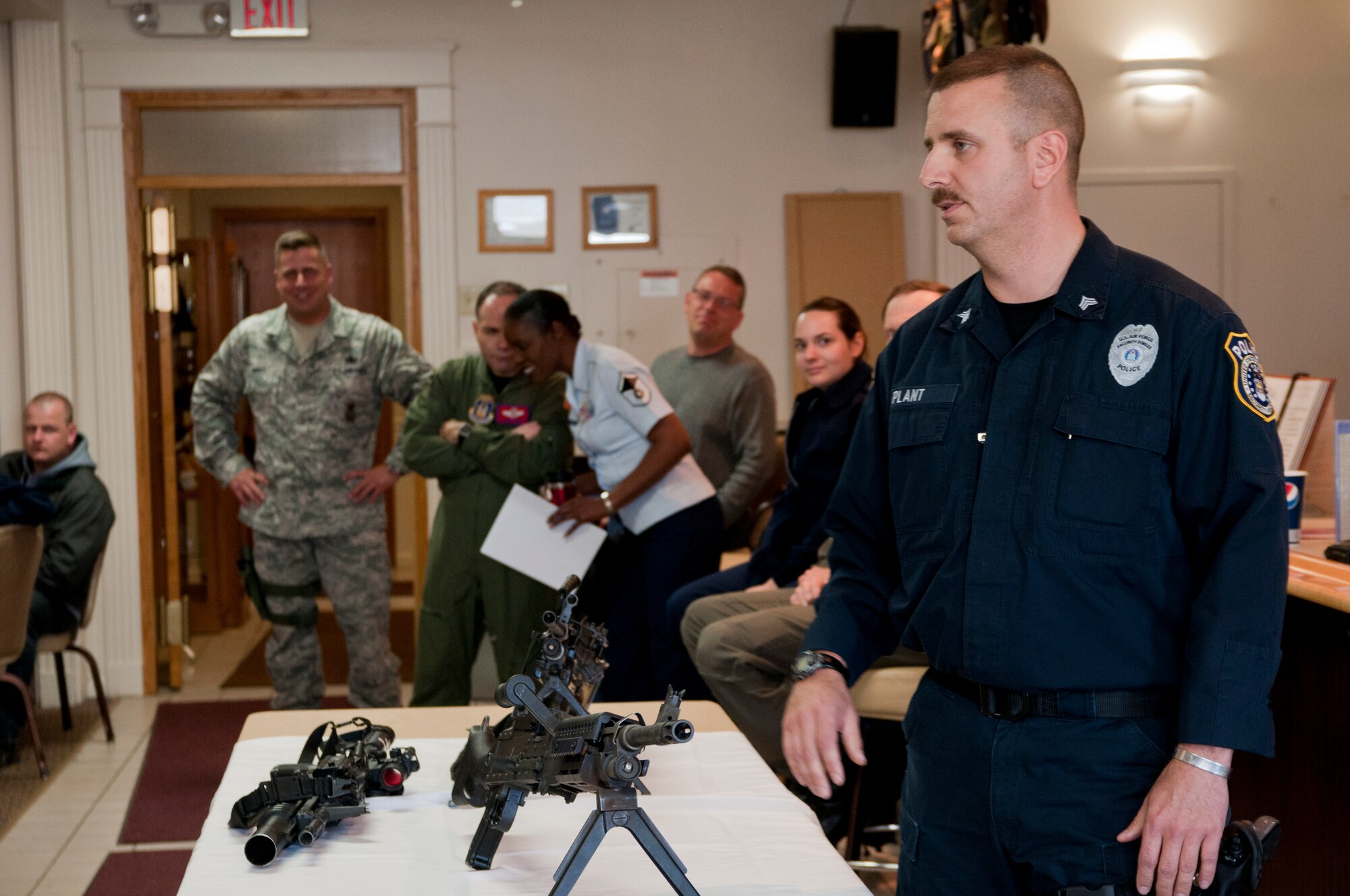 YOUNGSTOWN AIR RESERVE STATION, Ohio — Master Sgt. Robert Plant, a Security Forces Squadron member with the 910th Airlift Wing here, briefs a group of Air Force Junior Reserve Officer Training Corps (AFJROTC) members on various Air Force Reserve weapon systems. Approximately 75 junior ROTC members from Midview High School's AFJROTC Program attended a base tour and orientation flight Wednesday. U.S. Air Force photo by Mr. Eric M. White.
