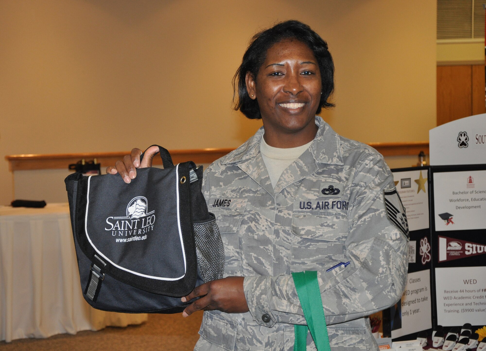 Joint Base Charleston hosted an education fair Friday April 15 for military members, families and retirees. Command Chief Jose LugoSantiago was in attendance to hand out door prizes from each of the schools to lucky fairgoers. (U.S. Air Force Photo/ 1Lt Joe Simms)