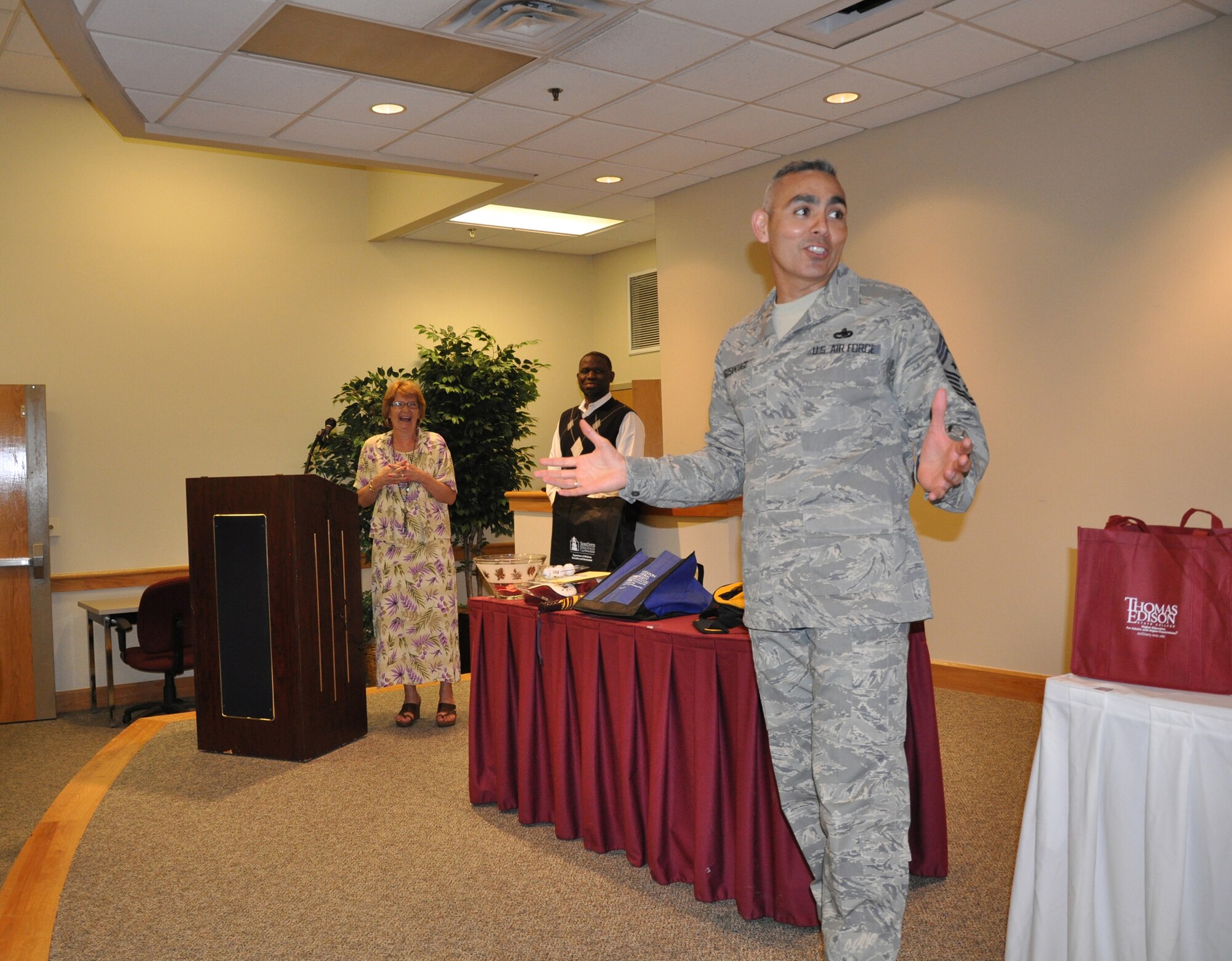 Joint Base Charleston hosted an education fair Friday April 15 for military members, families and retirees. Command Chief Jose LugoSantiago was in attendance to hand out door prizes from each of the schools to lucky fairgoers. (U.S. Air Force Photo/ 1Lt Joe Simms)