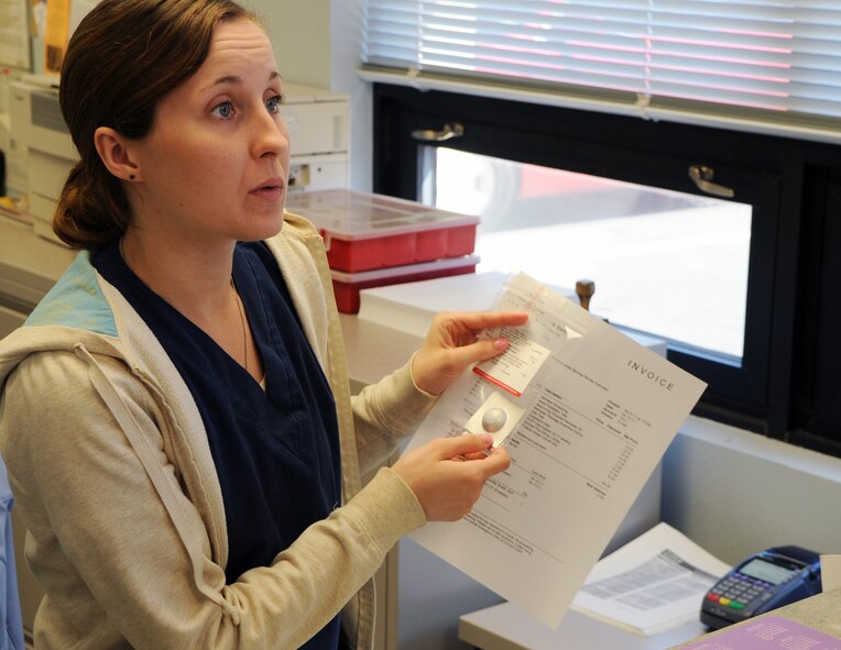 Operations Clerk Sarah Lammers processes clients at the Barksdale Vet Clinic on Barksdale Air Force Base, La., April 13. The clinic performs parasite testing, vaccinations, routine dental procedures and surgeries, heartworm testing, micro-chipping and spays and neuters. More information about the Barksdale Vet Clinic can be found at www.barksdaleservices.com by selecting vet clinic under the Airman and family tab. (U.S. Air Force photo/Airman 1st Class Micaiah Anthony) (RELEASED)