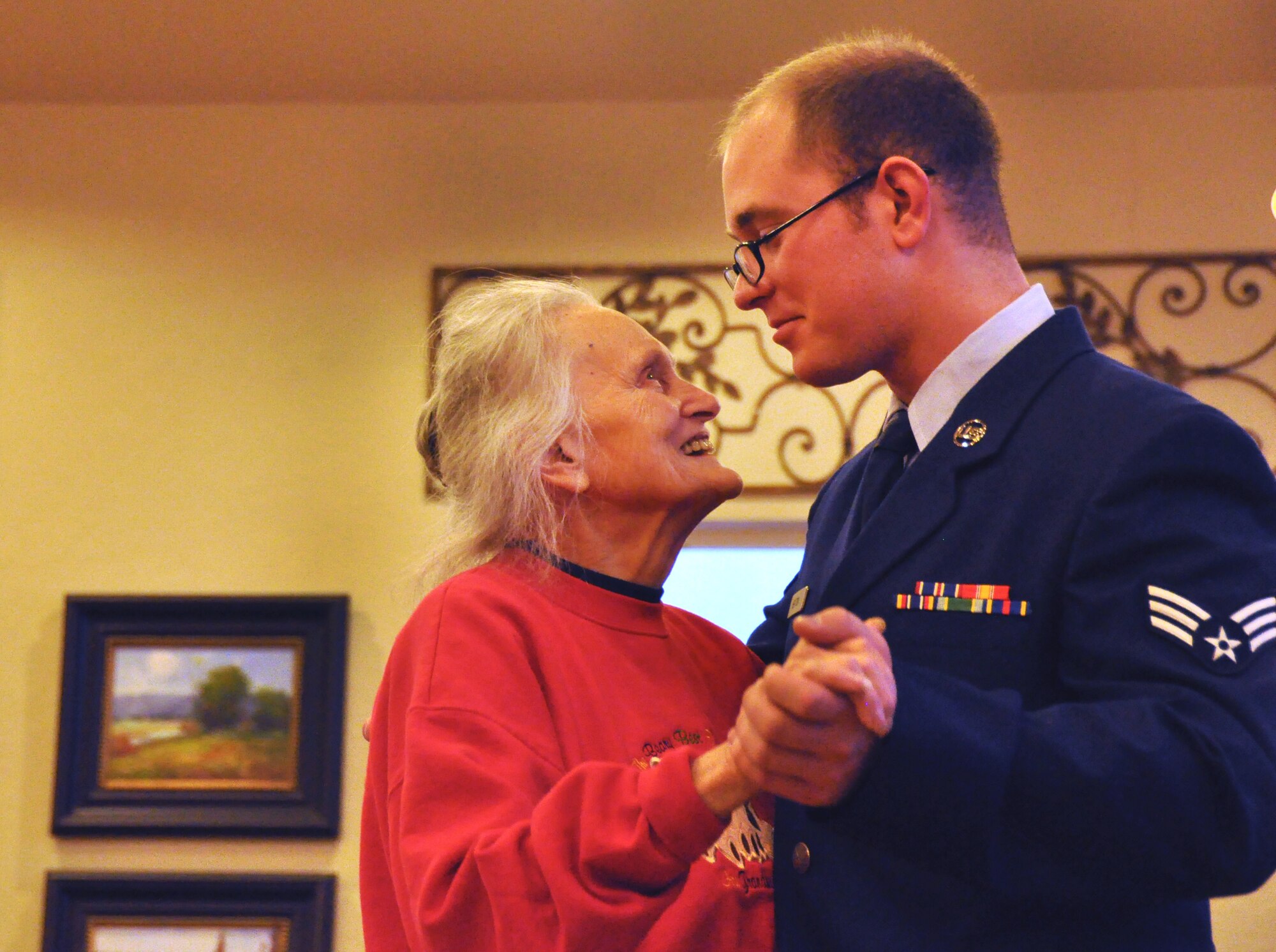 Ms. Connie Cannon, a resident at Chancellor Gardens Assisted Living Center, dances with Senior Airman Jacob Heaton, an Air Force Reservist in the 419th Fighter Wing’s aircraft maintenance squadron. Citizen Airmen from the wing joined senior citizens for the center’s formal spring dance April 14. (U.S. Air Force photo/Bryan Magaña)