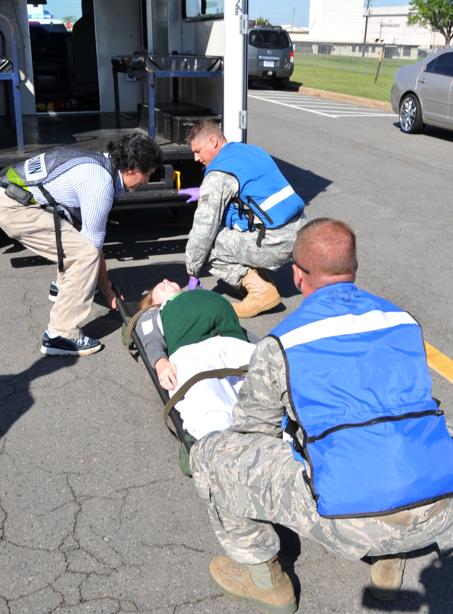 Members of the 19th Medical Group first responder team transport a simulated casualty after a major accident response exercise April 12, 2011, at Little Rock Air Force Base, Ark. Team Little Rock members participated in the MARE to stay current with their training in case of a real world event. (U.S. Air Force photo by Airman 1st Class Rusty Frank)