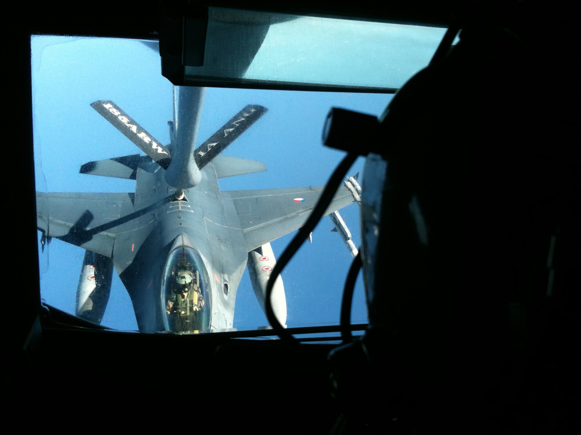 A KC-135 Stratotanker deployed from the 185th Air Refueling Wing, Sioux City, Iowa, provides aerial refueling for a Royal Netherlands Air Force F-16AM. The mission took place somewhere over the Mediterranean Sea in support of Operation Unified Protector April 8. The 313th AEW supports Operation Unified Protector, a NATO-led mission in Libya to protect civilian and civilian-populated areas under threat of attack. The 313th AEW provides aerial refueling to U.S. and Coalition aircraft with KC-135 Stratotankers and KC-10 Extenders.  (U.S. Air Force photo/Tech. Sgt. Scott Wilcox)