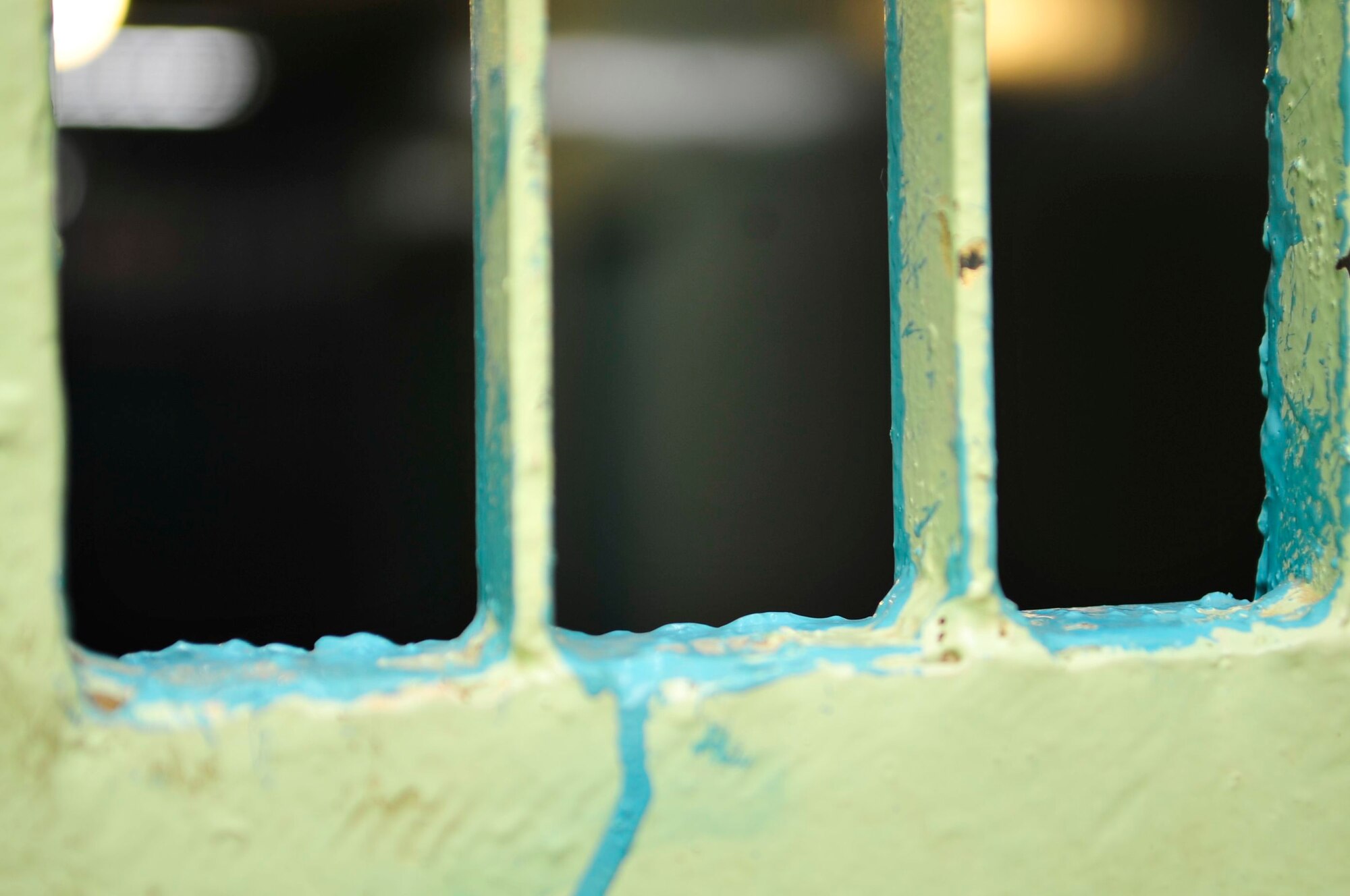 Blue paint is seen around the bars on a door leading inside to the inmate area at an Iraqi prison in Baghdad’s Rusafa Prison Complex, April 6, 2011. (U.S. Air Force photo by Senior Master Sgt. Larry A. Schneck)