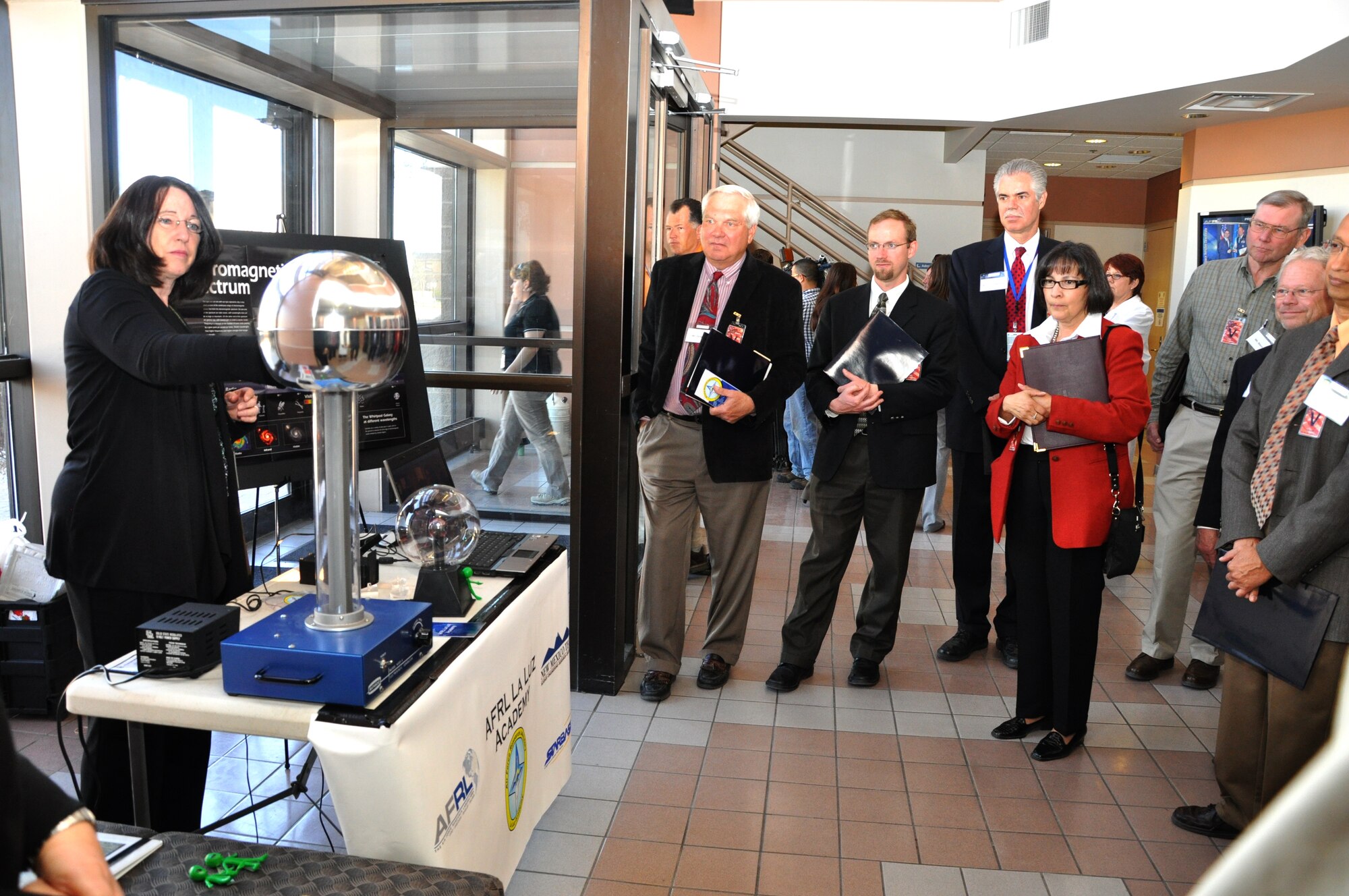 Diane MacAlpine, deputy director of the Air Force Research Laboratory’s La Luz Academy, demonstrates the concept of solar wind with a Van de Graaff generator  for State Day visitors.  Courtesy photo by Anita Collins