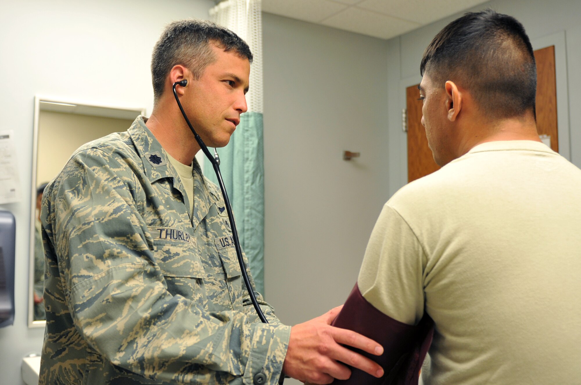 Lt. Col. Jefferson Thurlby, 19th Medical Group chief of medical staff, checks a patient’s blood pressure April 12, 2011, at Little Rock Air Force Base, Ark. The Russellville, Ark., native is a member of the deployment availability working group addressing chronic pain and high utilizers, saving the Air Force tens of thousands of dollars in medical care and lost work days. (U.S. Air Force photo by Airman 1st Class Rusty Frank)