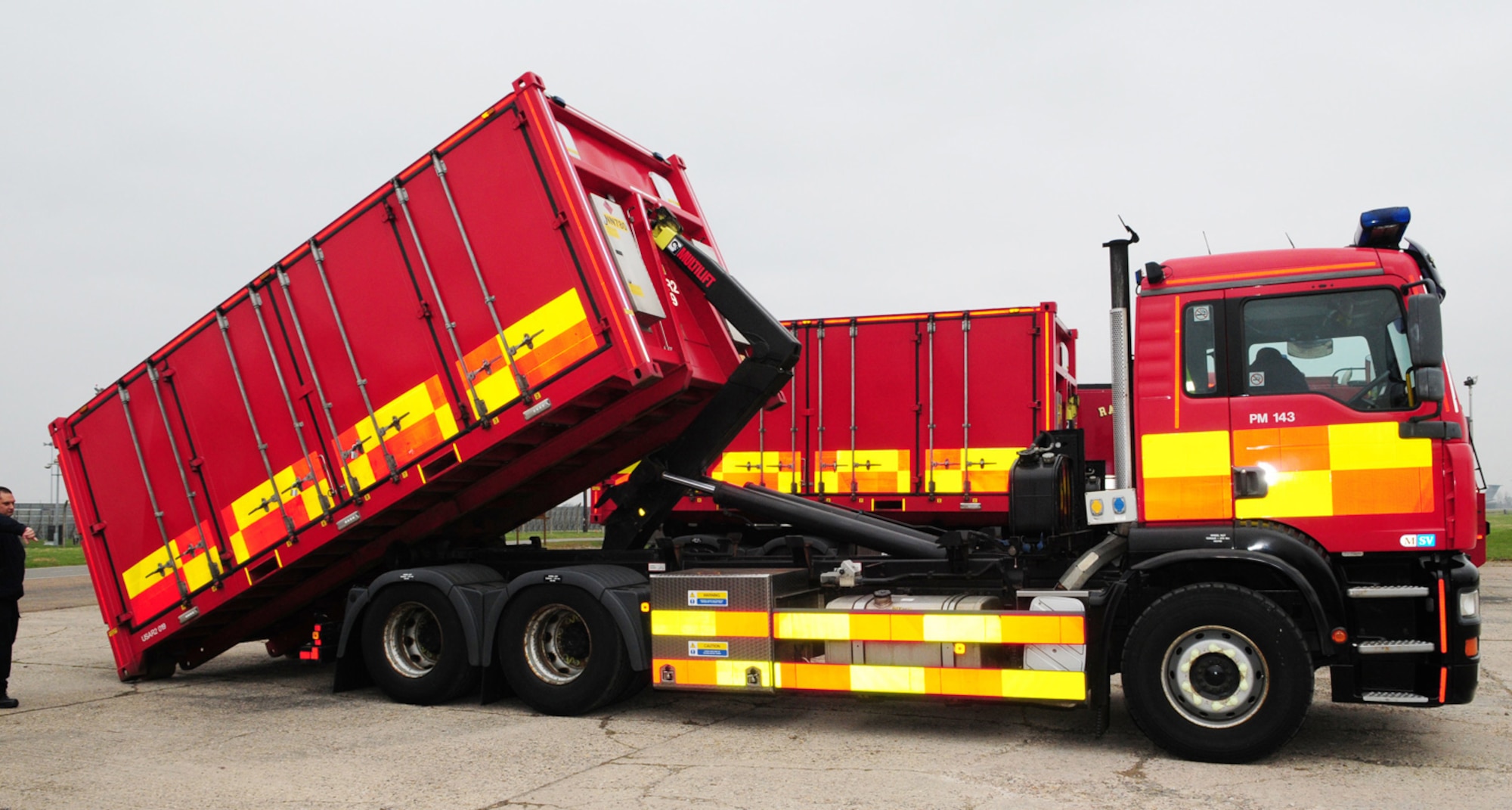 RAF MILDENHALL, England -- Two prime mover trucks, from the Norfolk Urban Search and Rescue, unload equipment modules brought here to showcase for members of the 100th Civil Engineer Squadron Fire Department March 30, 2011. One module contains equipment known as "first strike," which includes scene survey equipment, lighting, power, search cameras and shoring-up equipment. The second module holds equipment used in heavy transport incidents, usually involving aircraft, hangars and railways. It contains items such as stretchers, rescue tripods for confined space rescues, chainsaws and cutting equipment. Four British firefighters from NUSR visited RAF Mildenhall to demonstrate their equipment. Having training sessions such as this gives both on- and off-base firefighters an awareness of the equipment each has, and how it's used, so in the event both departments work together on a large incident, it will enable operations to run smoothly. (U.S. Air Force photo/Karen Abeyasekere)