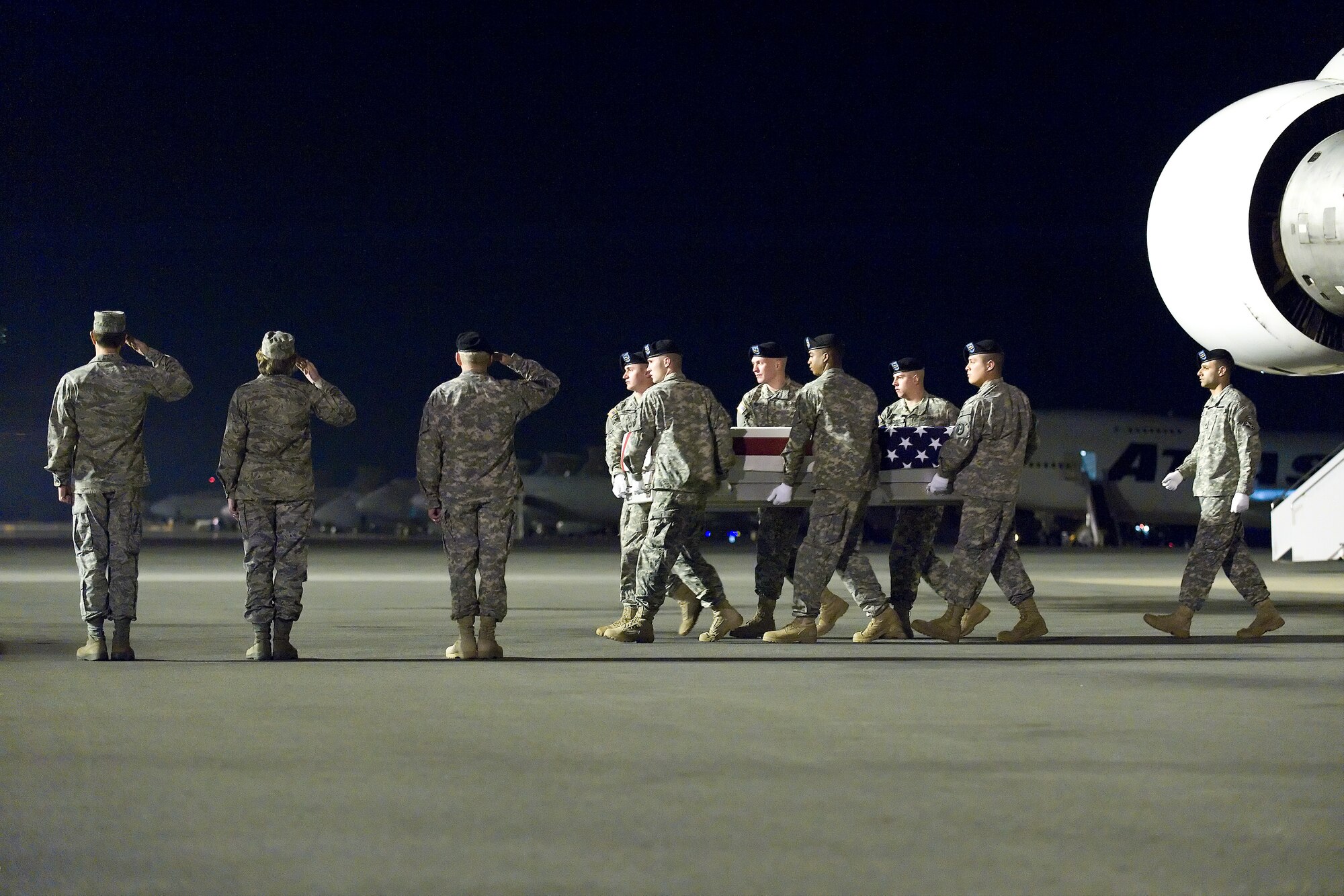 A U.S. Army carry team transfers the remains of Army Pvt. Brandon T. Pickering, of Fort Thomas, Ky., at Dover Air Force Base, Del., April 15, 2011. Pickering was assigned to the 2nd Battalion, 4th Infantry Regiment, 4th Brigade Combat Team, 10th Mountain Division, Fort Polk, La. (U.S. Air Force photo/Roland Balik)